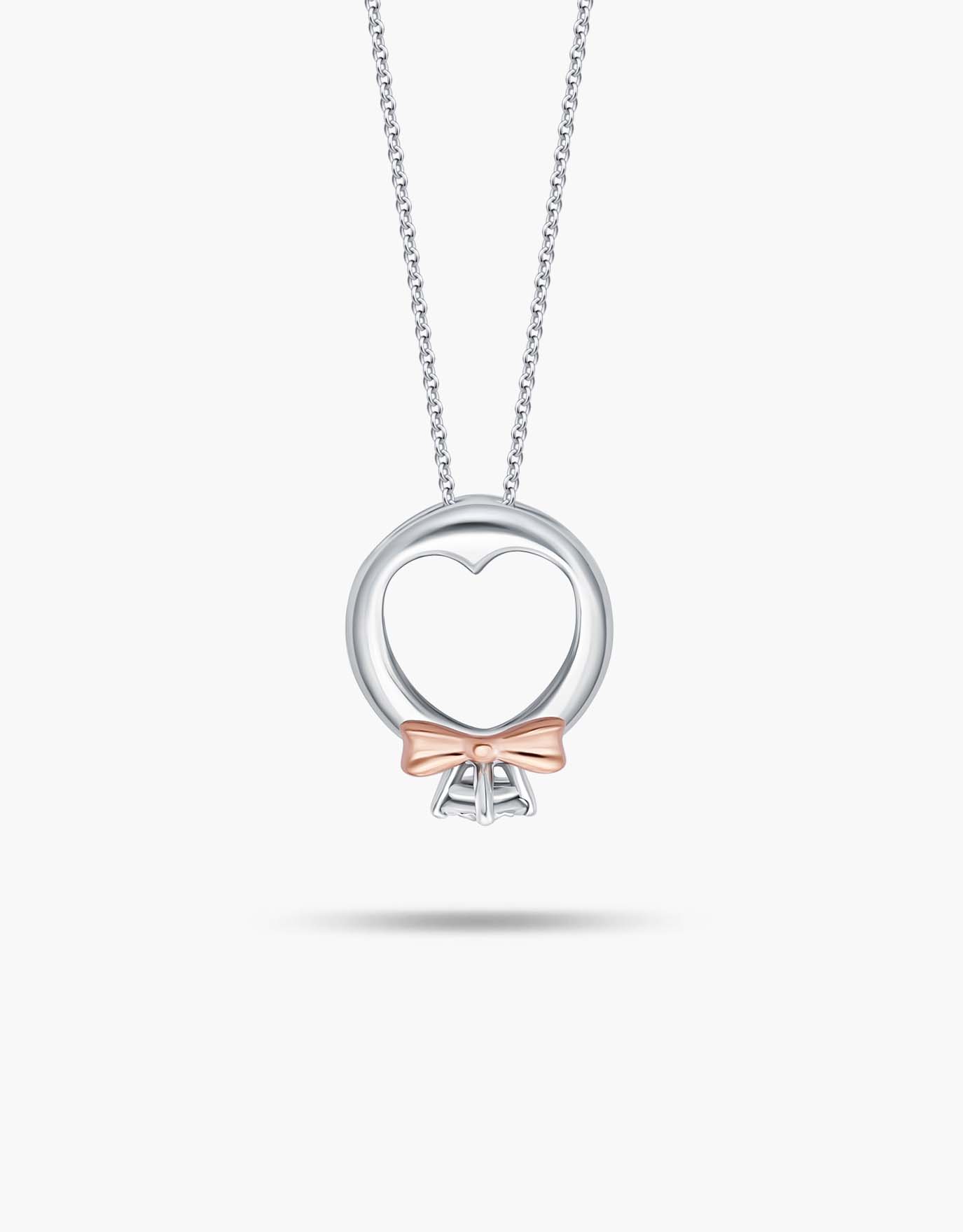 LVC diamond necklace in white gold with Mini Ring Diamond Pendant features a unique heart-shaped band with rose gold accents added to the bow