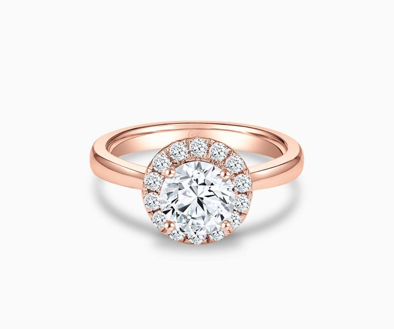 round diamond halo engagement ring set in rose gold with a tapered plain band design