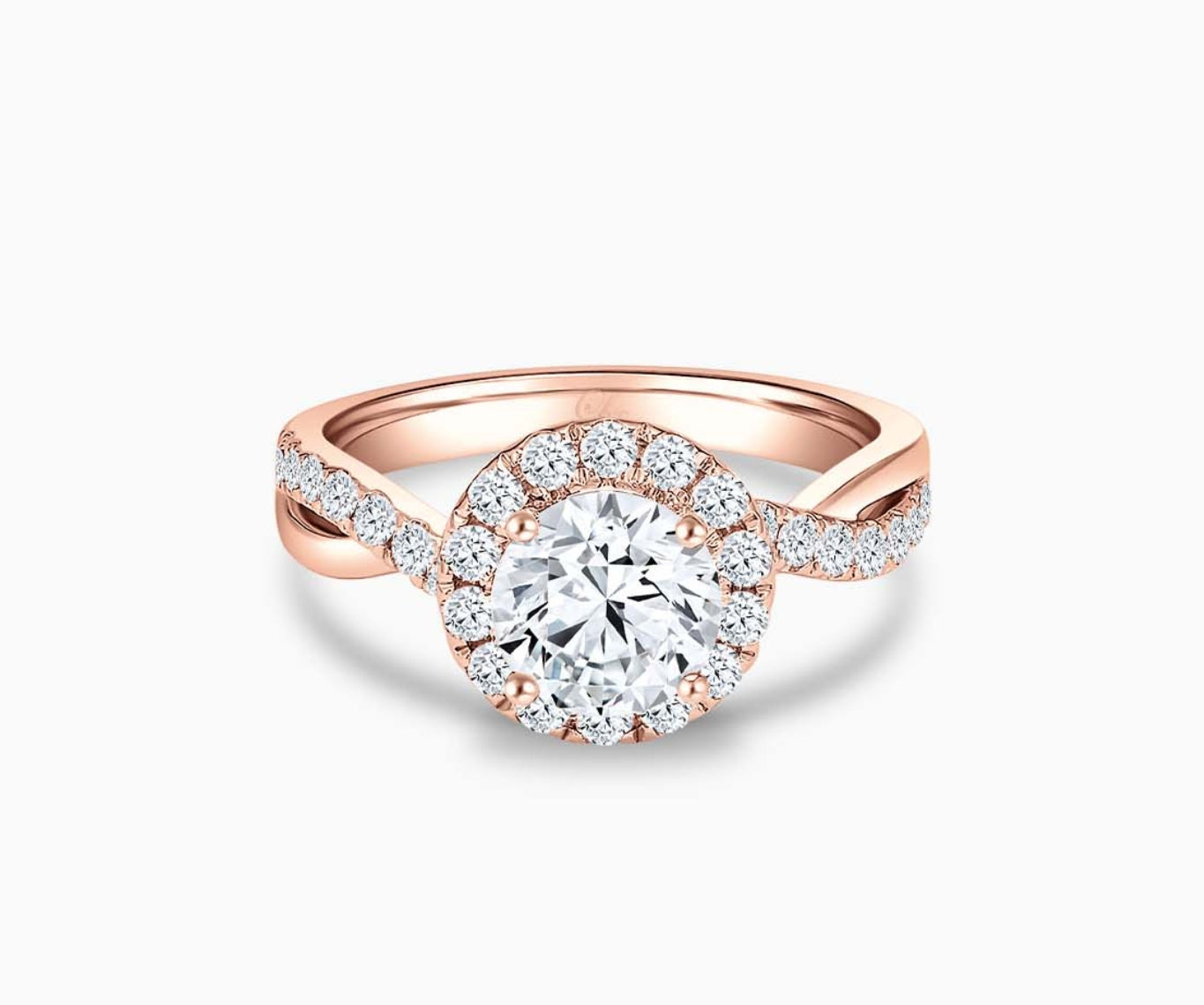 round diamond halo engagement ring set in rose gold with a twisted pave band design