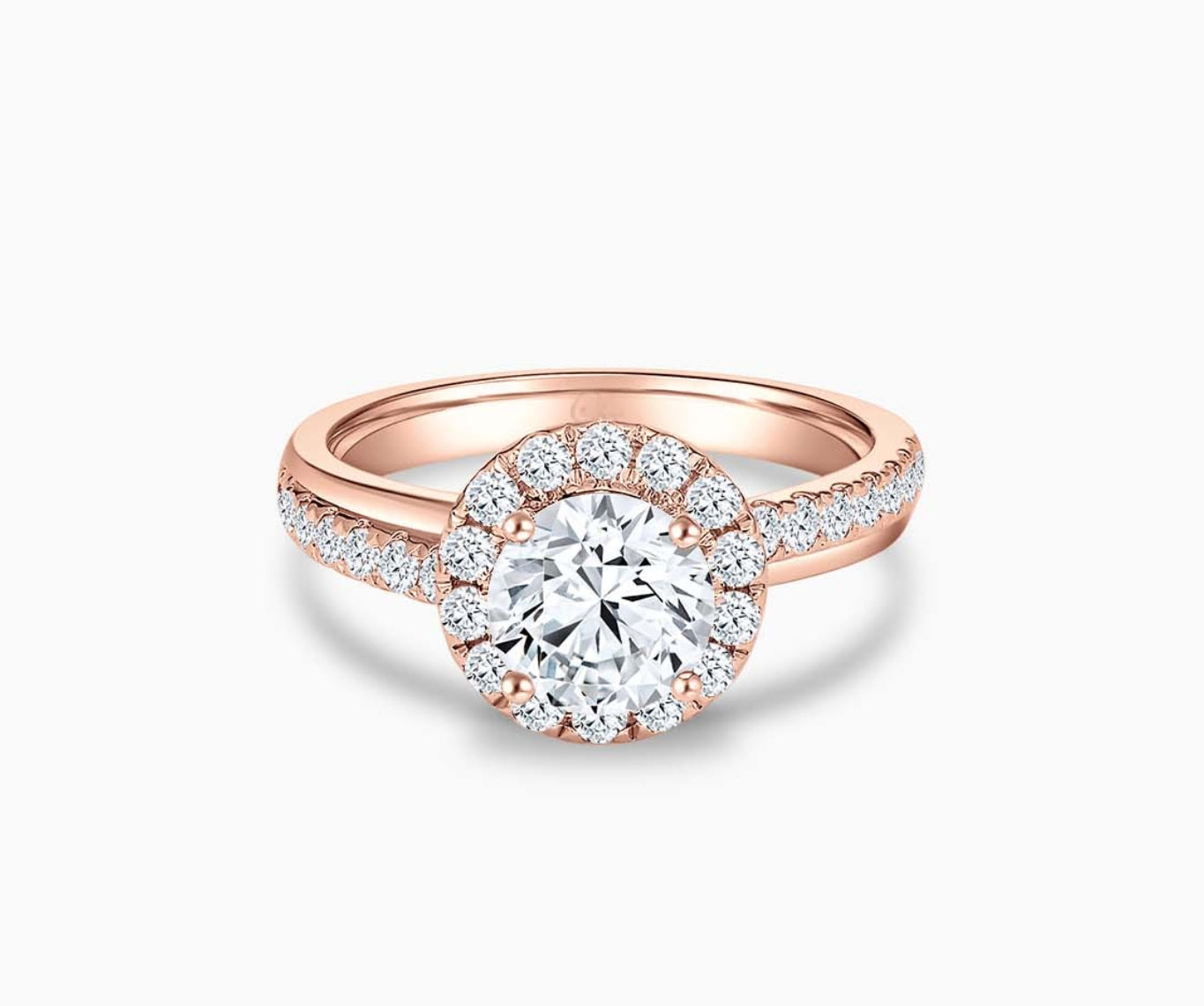 round diamond halo engagement ring set in rose gold with a double pave band design