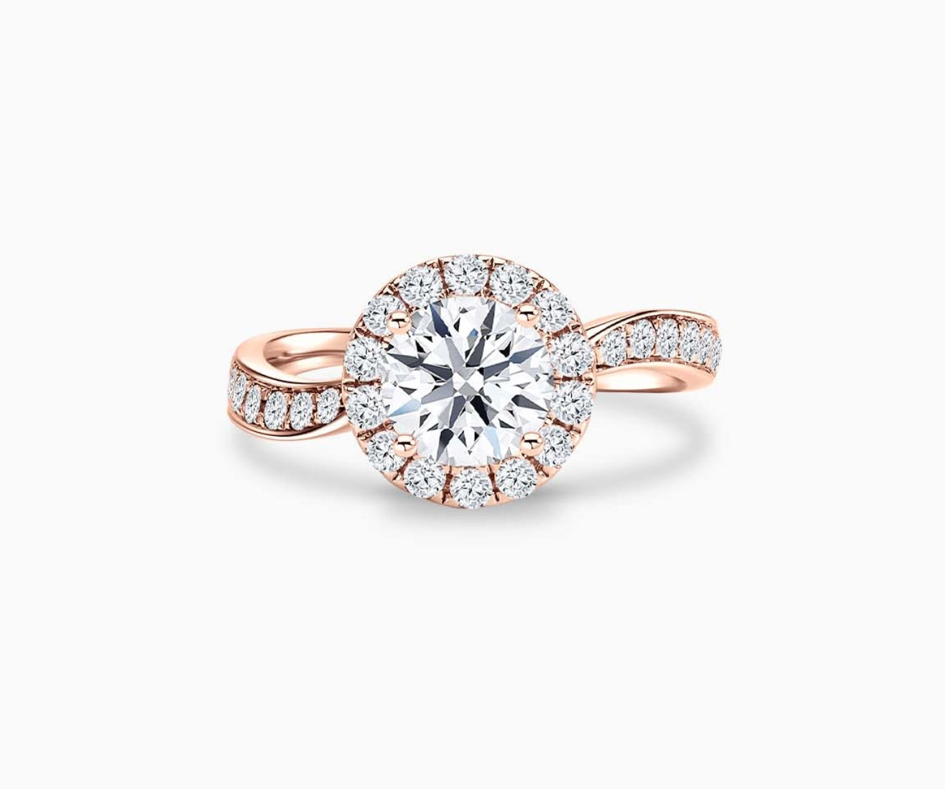 round diamond halo engagement ring set in rose gold with a twirl pave band design
