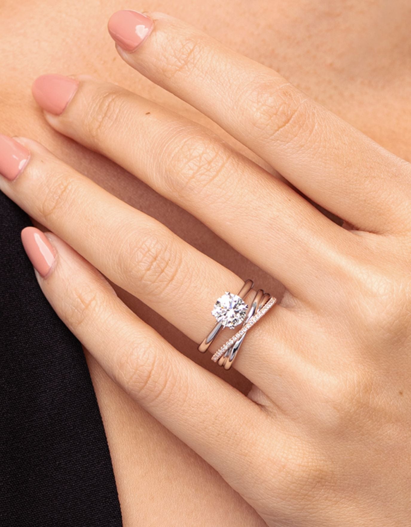 LVC lab grown diamond ring solitaire  being stacked together with wedding ring on a woman's finger