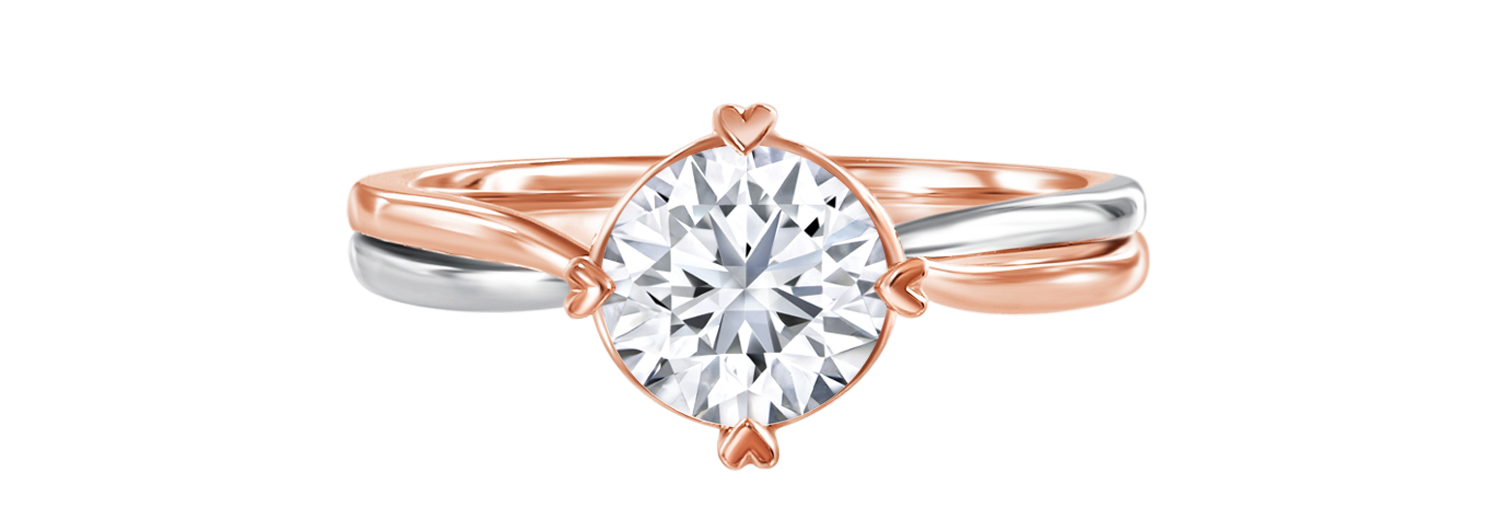 LVC a close up of the lab grown diamond ring from the say love collection featuring 4 prongs in heart shape in rose gold