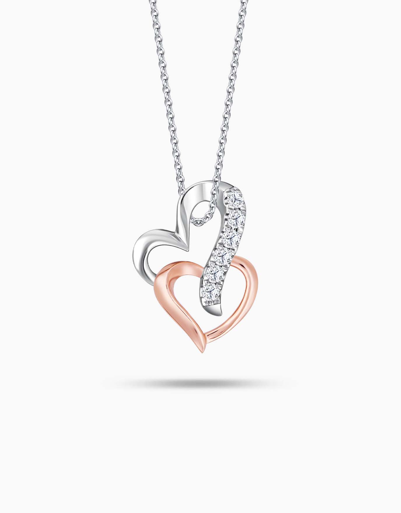 LVC diamond necklace features two intertwined white and rose gold hearts encrusted with diamonds