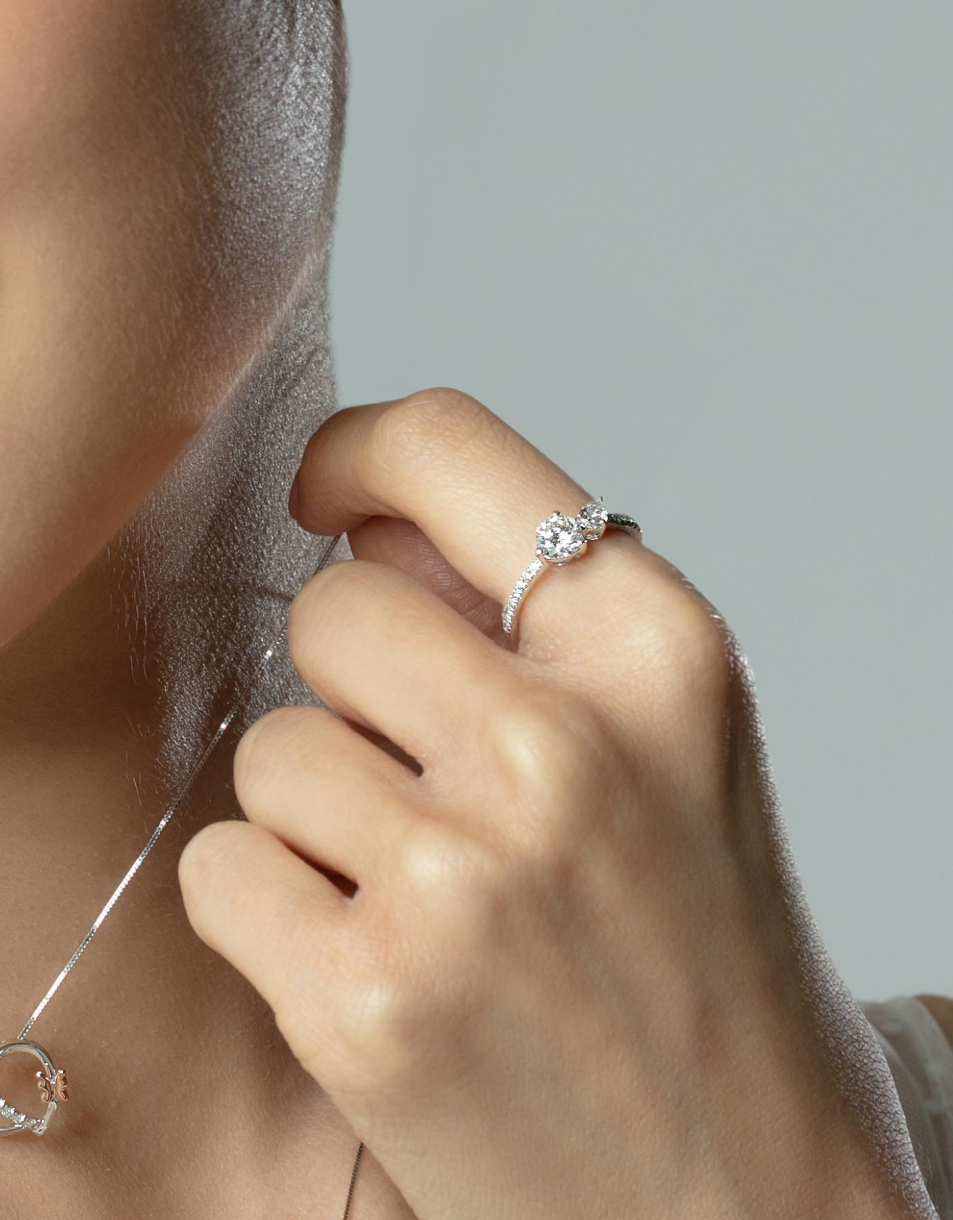 LVC a woman wearing the white gold lab grown diamond ring on her index finger