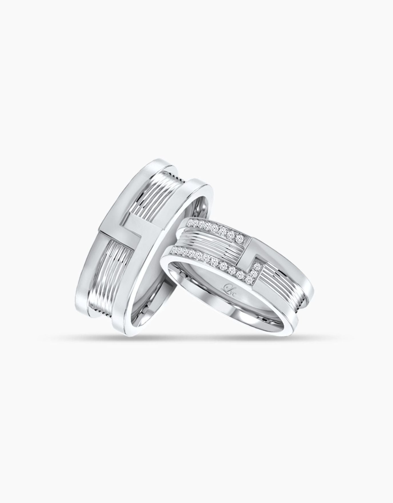 LVC wedding couple rings in white gold with diamonds fitted with our signature bolt and nut look