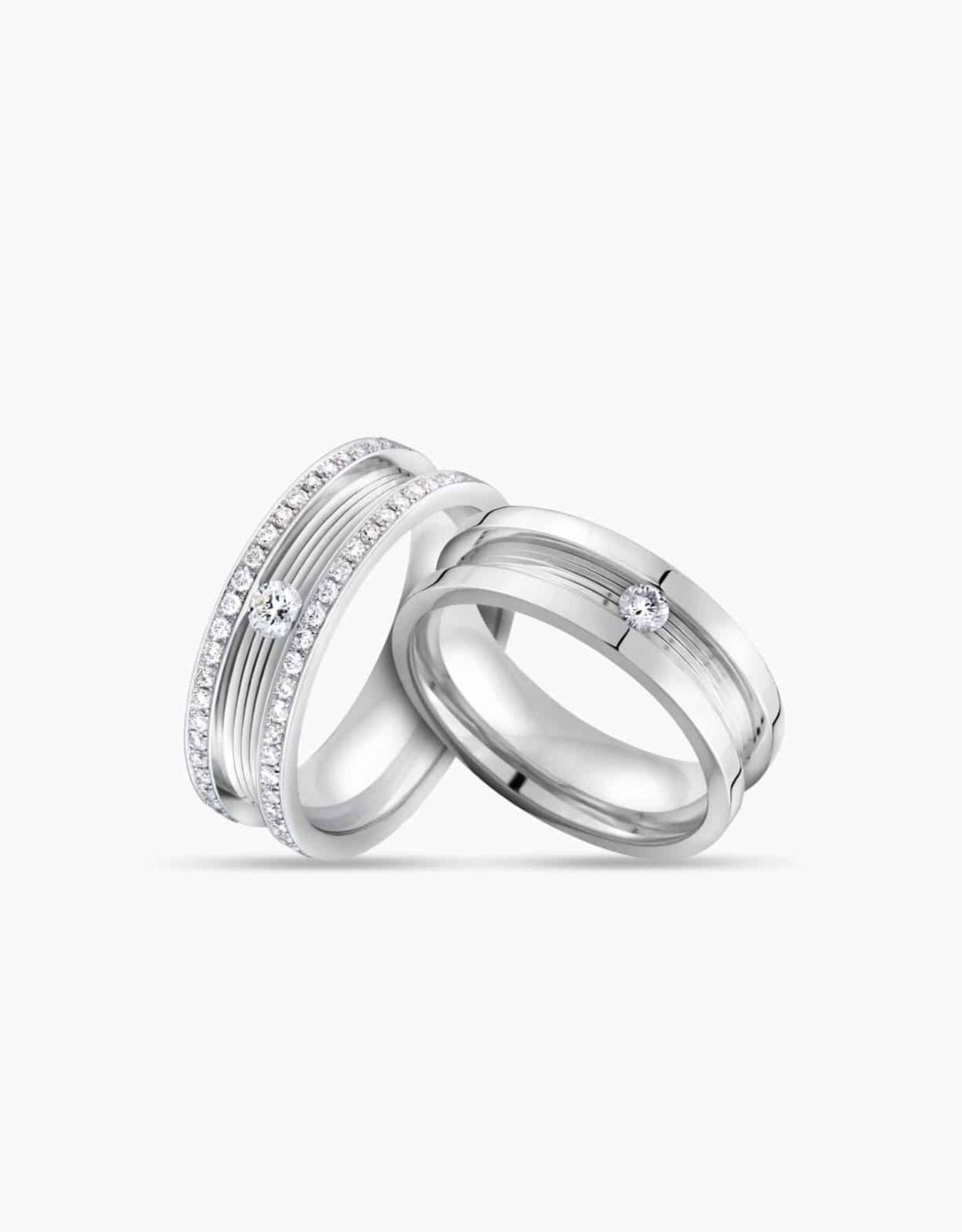 LVC couple wedding rings in white gold topped with a center diamond stone and finished with full round side diamonds