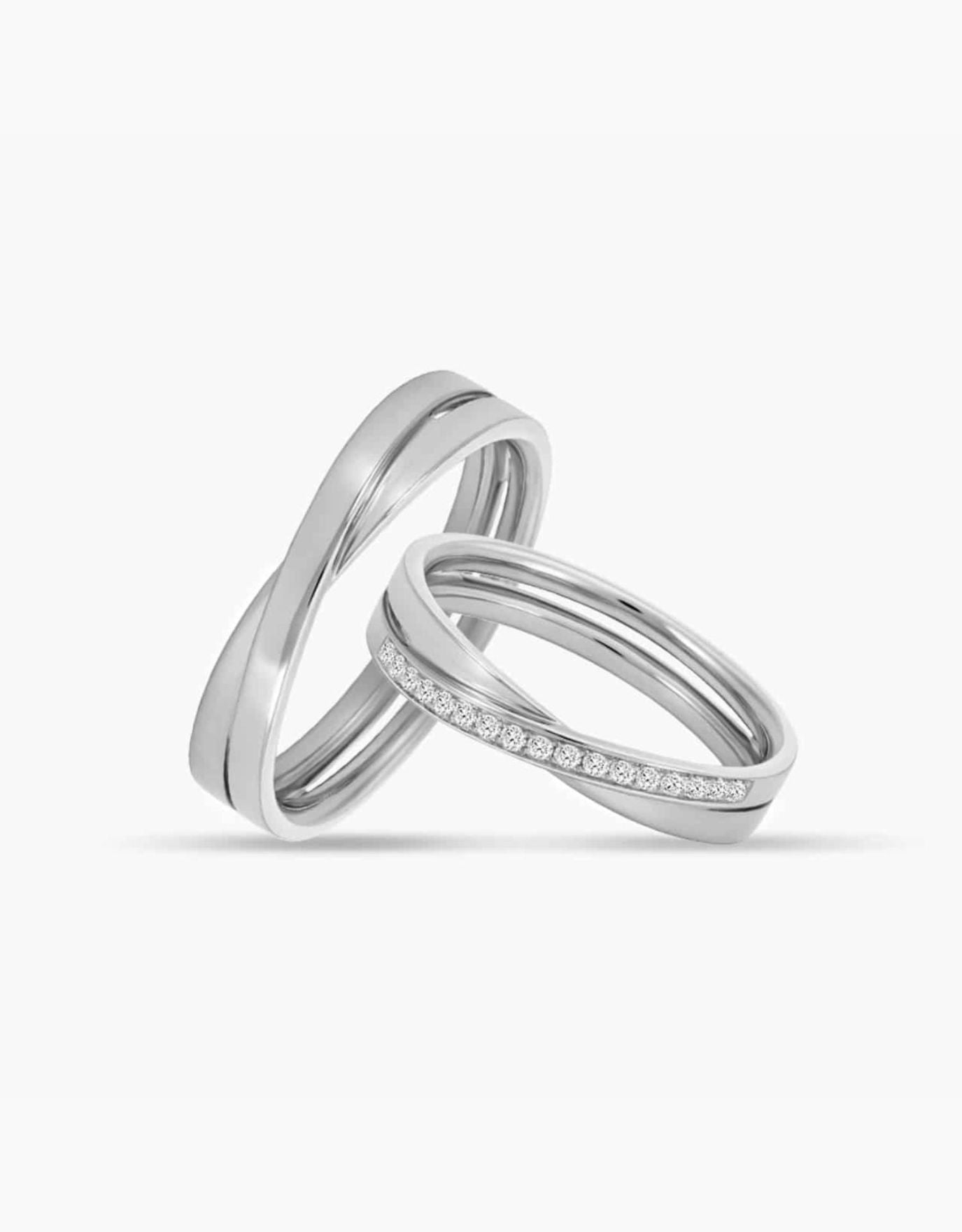 LVC couple wedding rings in white gold with glossy finish designed with a unique cross on the band for simplicity and elegance 