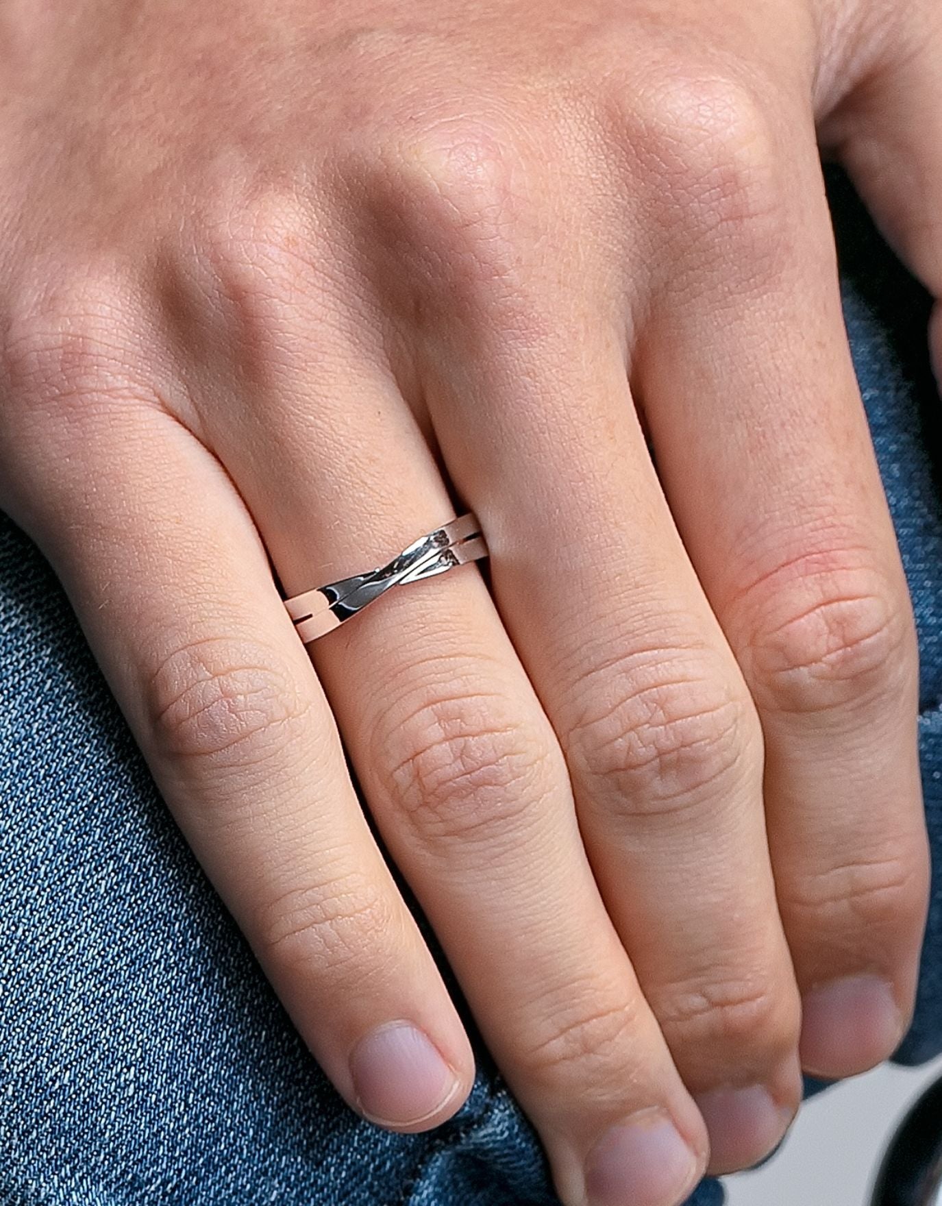 LVC men wedding band in white gold with glossy finish designed with a unique cross on the band for simplicity and elegance worn on ring finger 