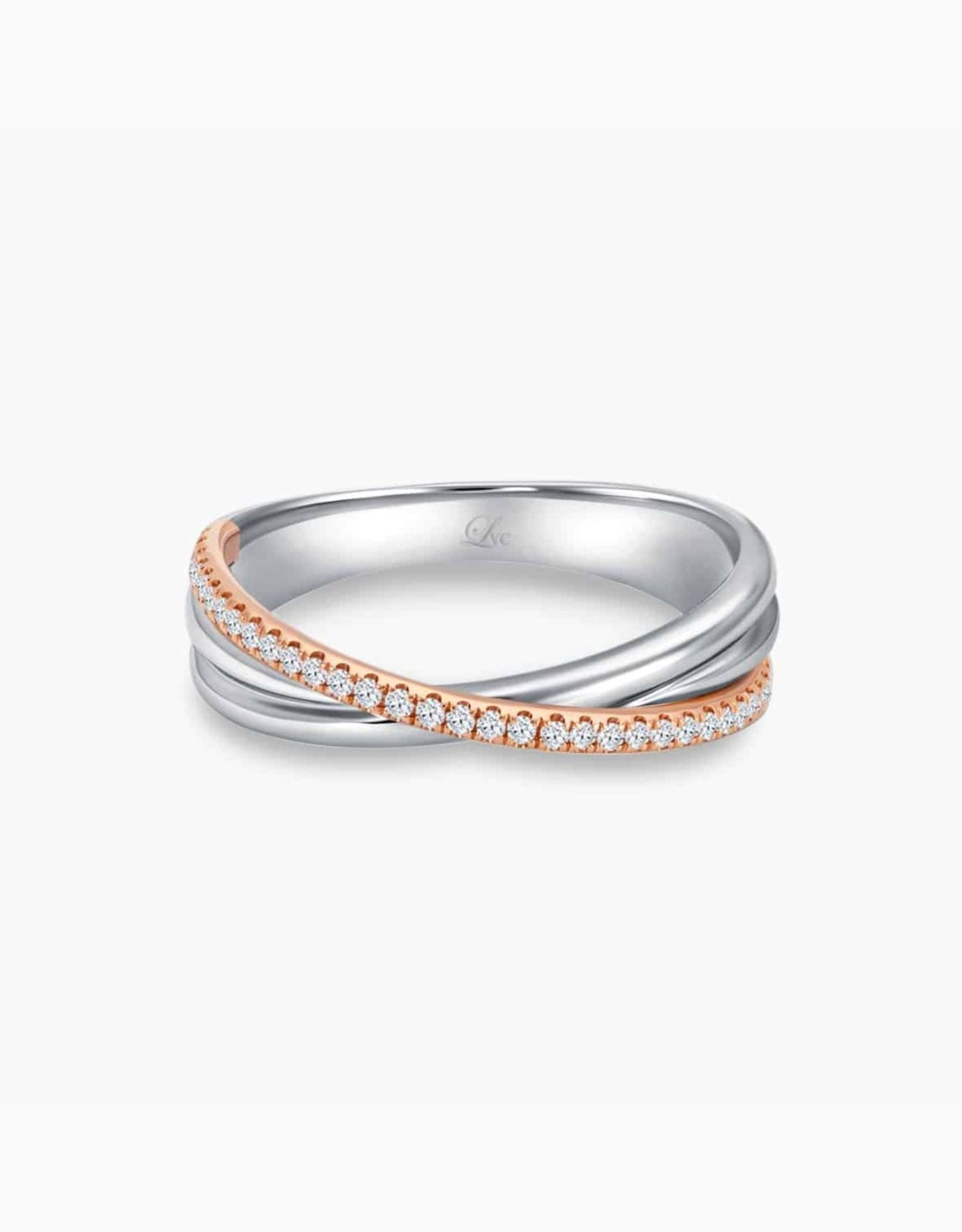 LVC wedding band in white and rose gold designed with an intertwining of bands fitted with a row of stunning diamonds that runs across the ring 
