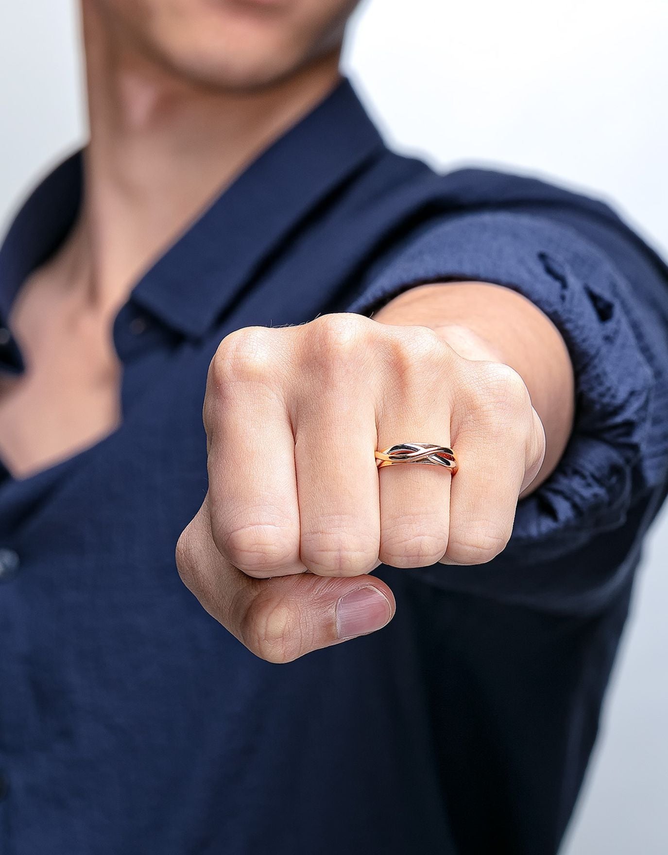 LVC mens diamond ring designed with entwined bands in white gold and rose gold forming an infinity symbol