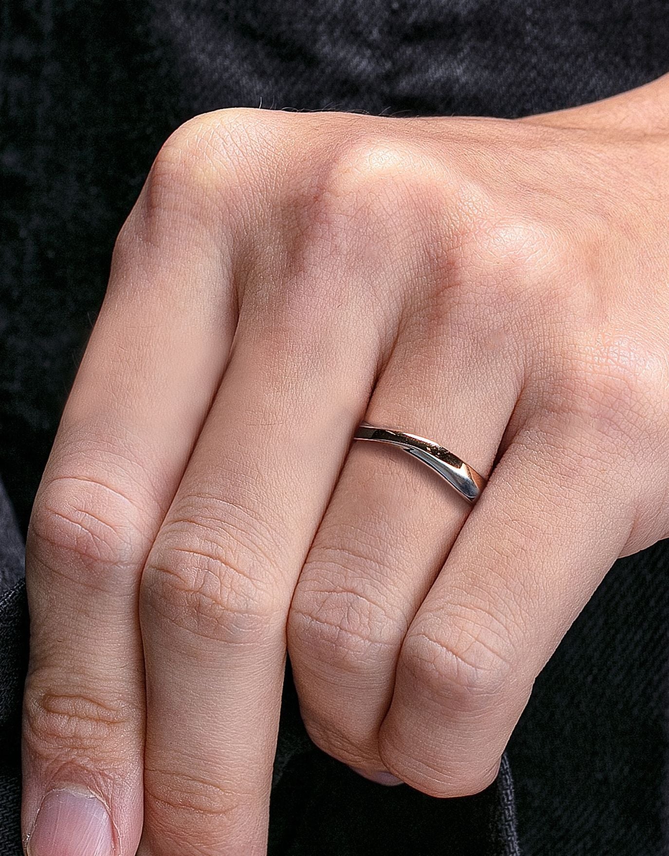 LVC men wedding ring in both white and rose gold with a diamond inside worn on ring finger