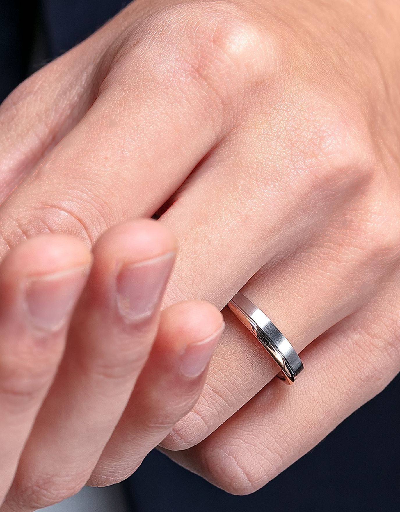 LVC mens diamond ring designed with the perfect balance of white and rose gold worn on ring finger