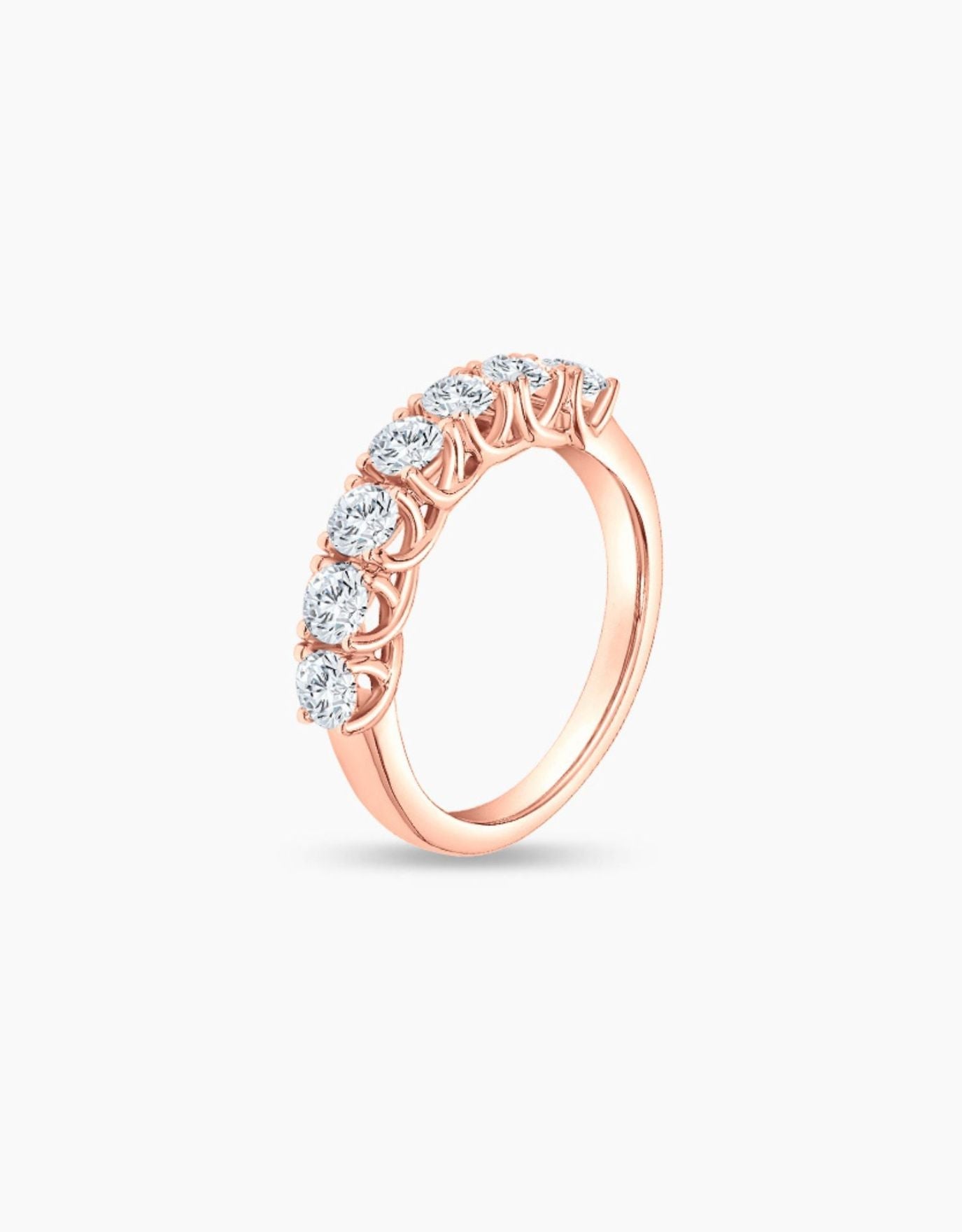 LVC wedding band in rose gold traced with glistening diamonds set in a pave setting seen from different angle