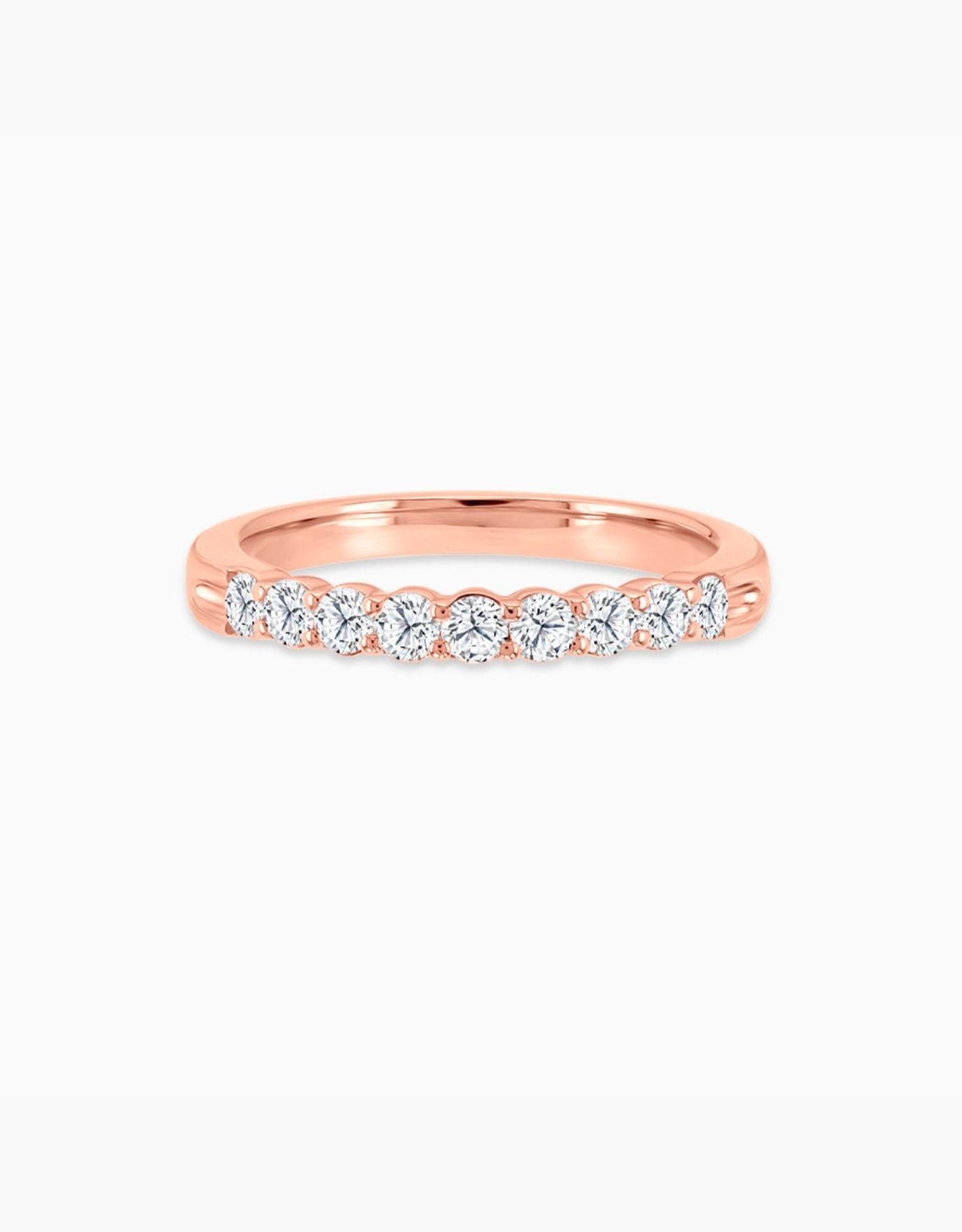 LVC wedding ring with lab grown diamonds on a rose gold band with glossy finish