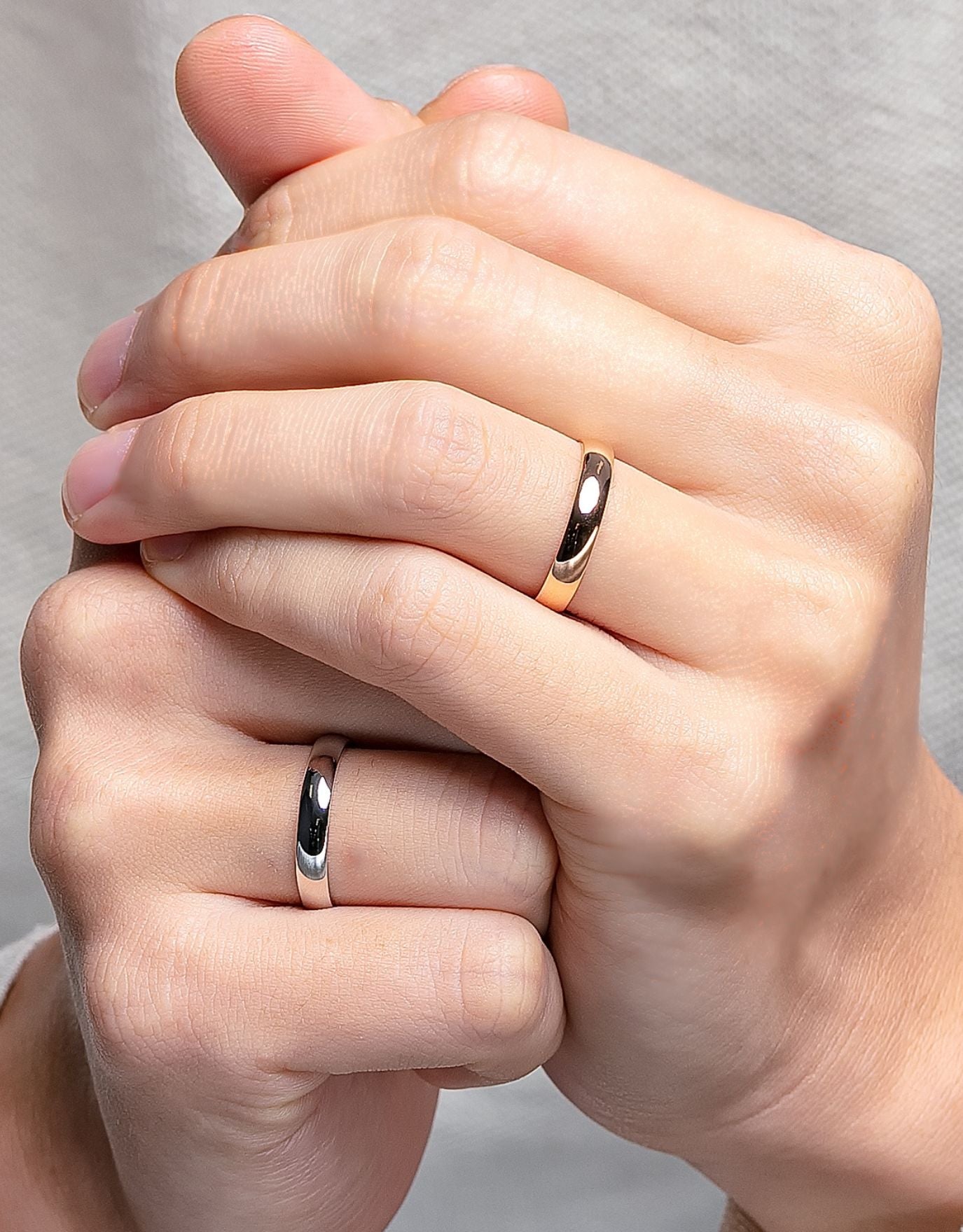 LVC men wedding band in white and yellow gold crafted with a polished look for the elegant and modern look worn on ring fingers 