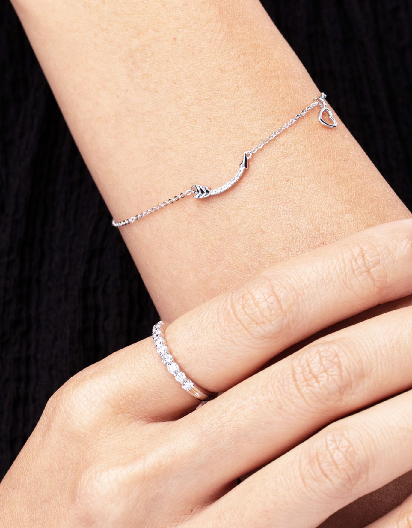 LVC wedding ring with diamonds worn on the index finger along with a bracelet in white gold