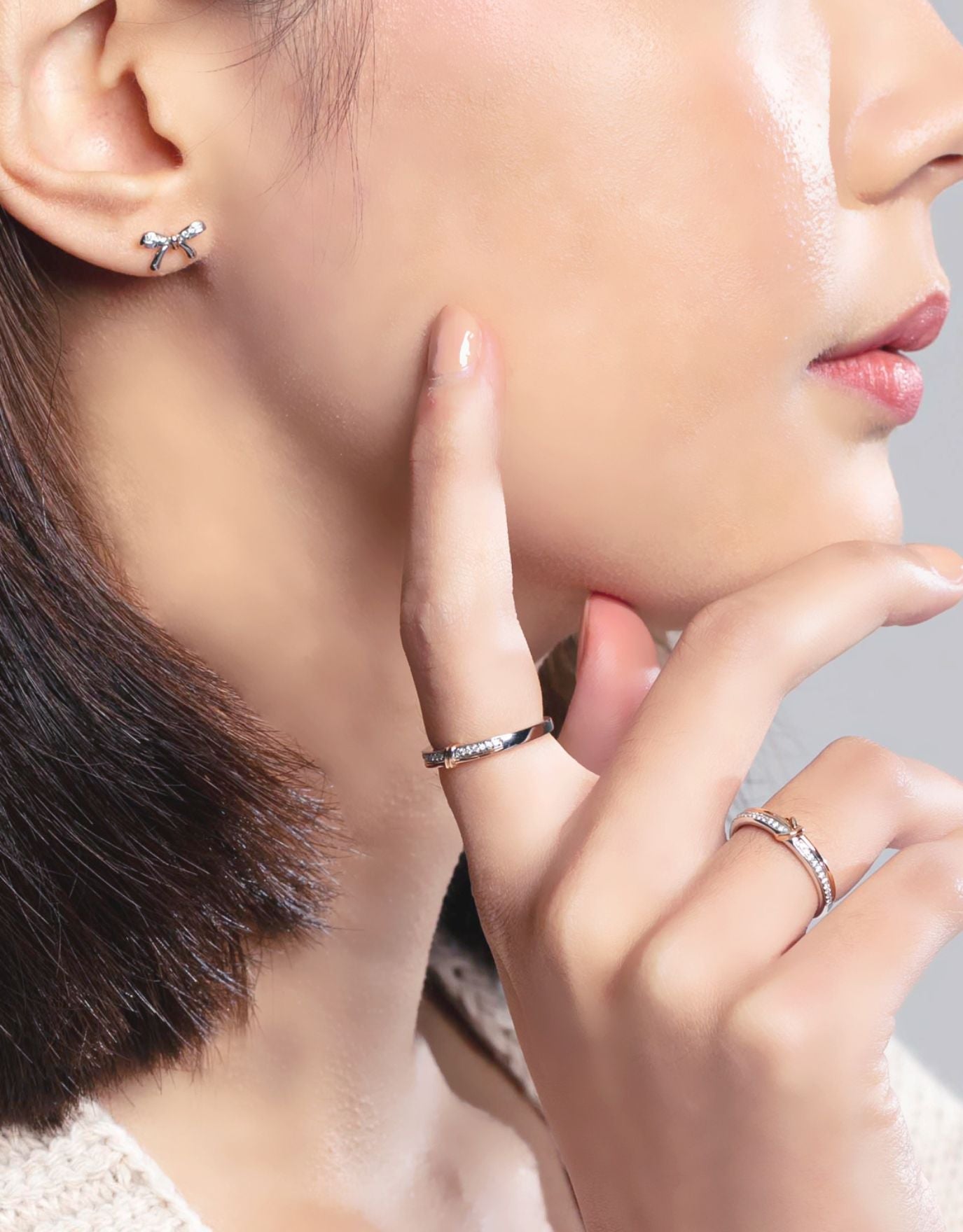 LVC wedding band with diamonds crafted with a perfect balance of white and rose gold worn by a woman