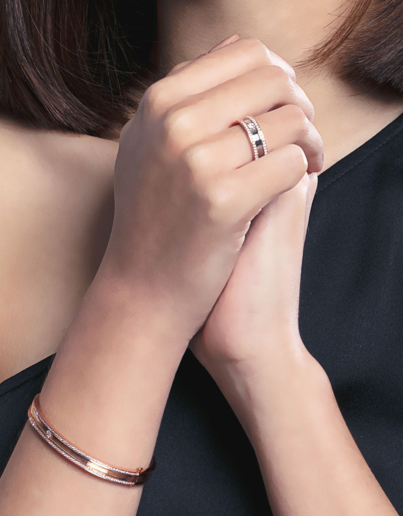 LVC wedding band in white gold topped with a center diamond stone and finished with full round side diamonds worn on ring finger