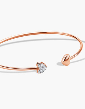LVC  Diamond bangles for women designed with two hearts aligned to each other with one encrusted in diamonds in rose gold