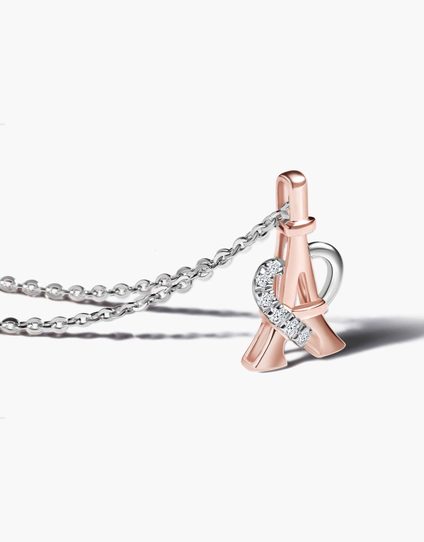 LVC necklace in white gold with a pendant designed in the shape of an Eiffel Tower in rose gold wrapped within a heart encrusted with diamonds