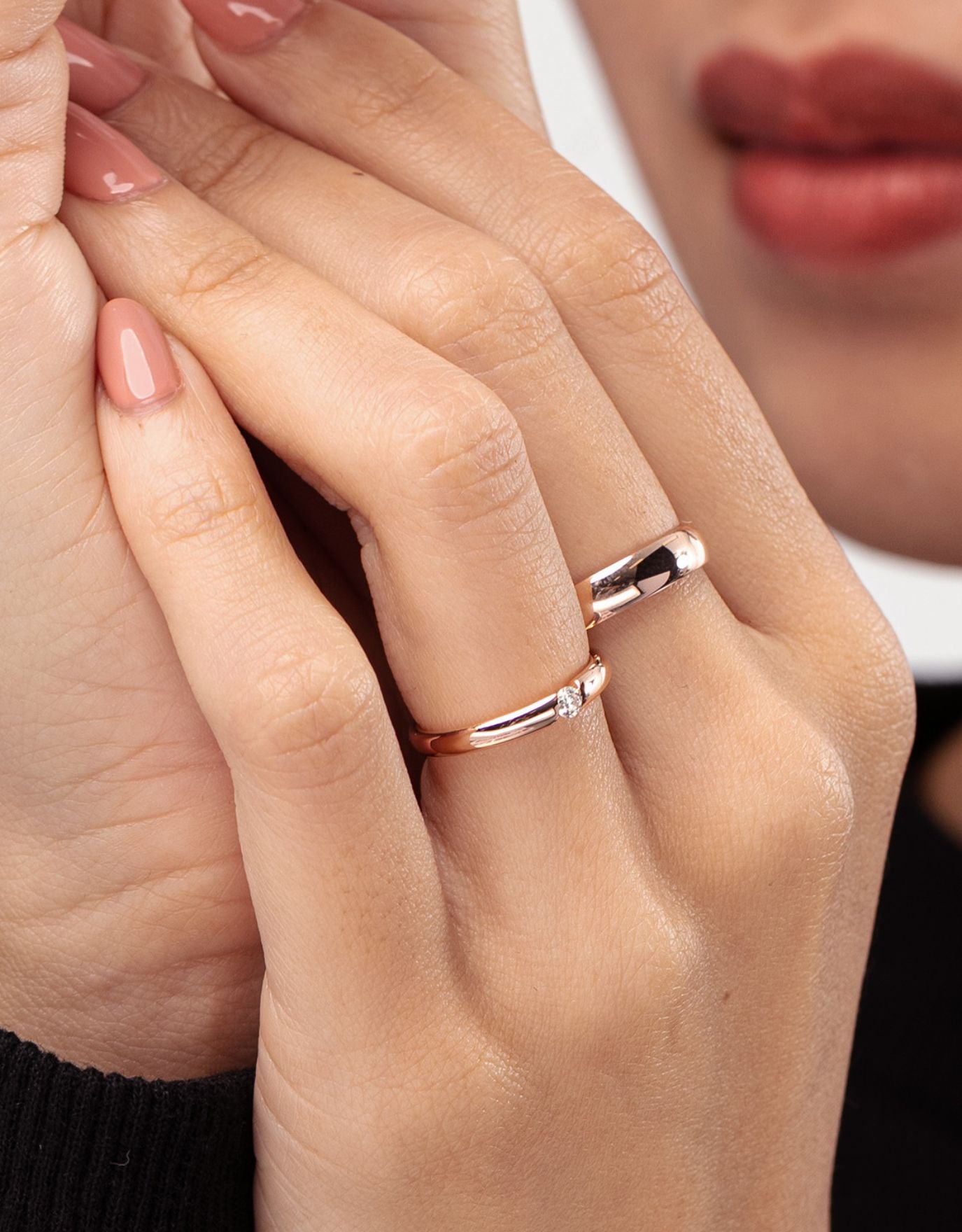 LVC wedding band in rose gold crafted with a center diamond stone worn on ring finger 