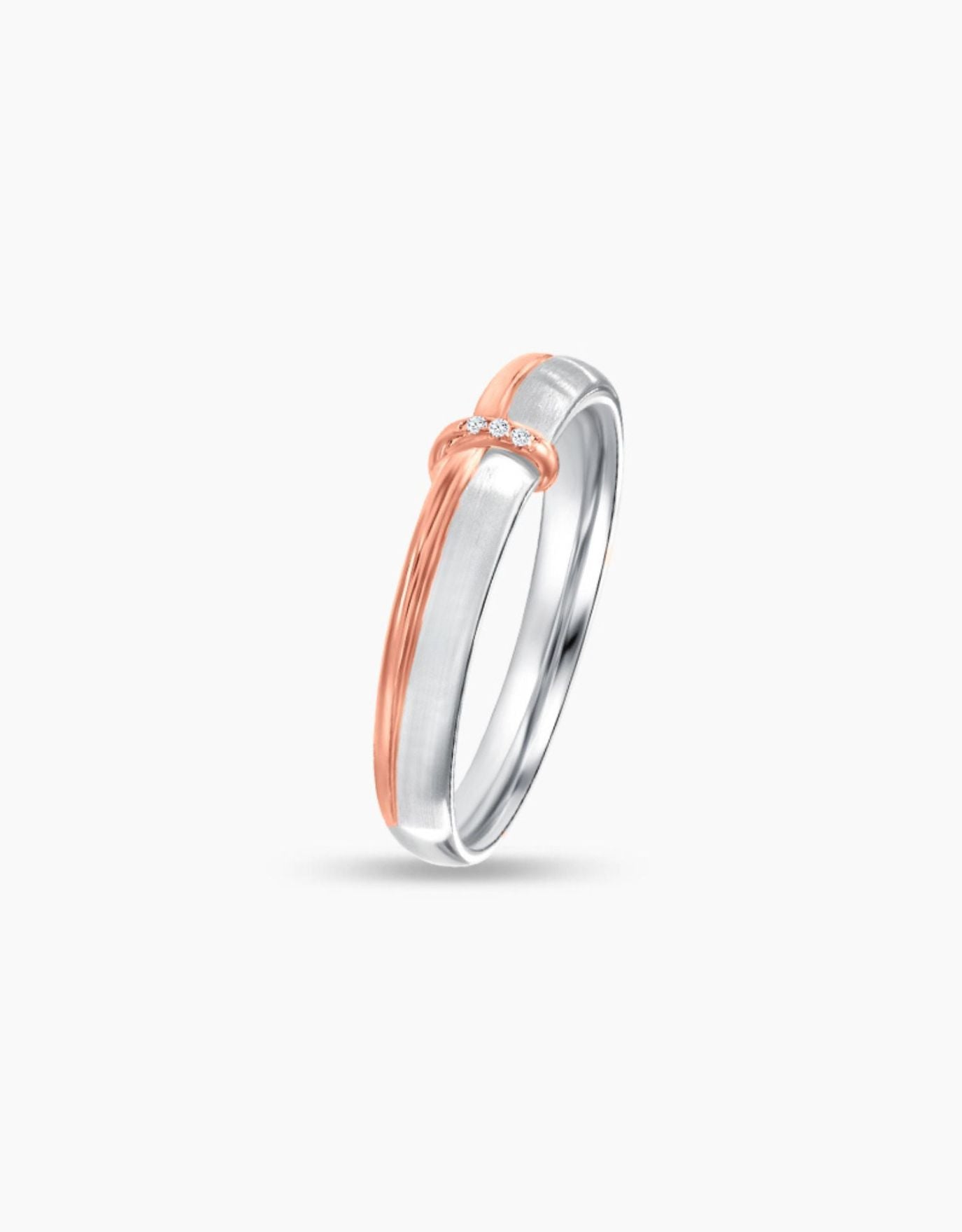 LVC wedding band designed with a dainty rose gold knot resting on a white gold ring completed with three diamonds seen from different angle