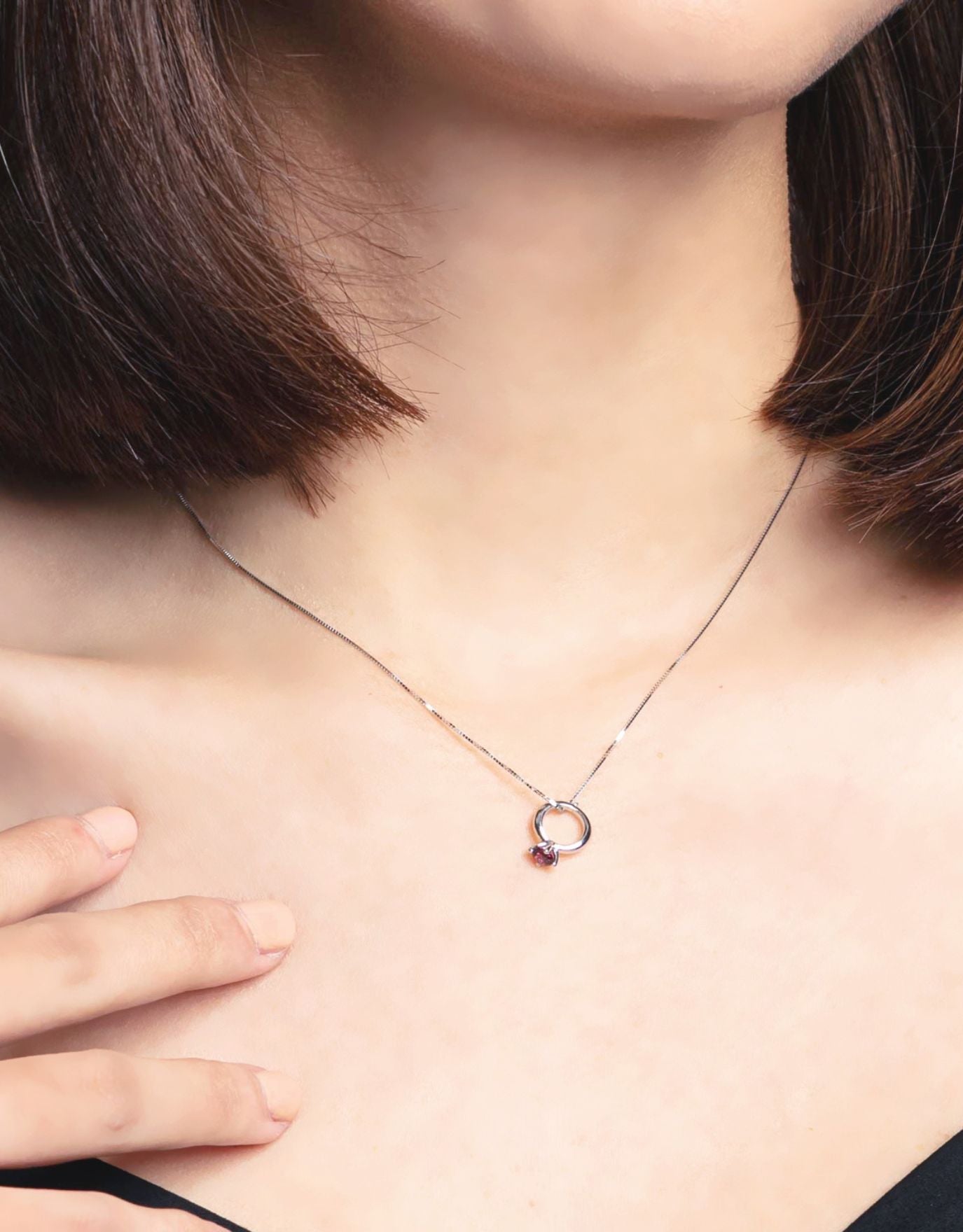 woman wearing LVC diamond necklace with Mini Ring Precious Stones Pendant features Rhodonite, a deep red gemstone