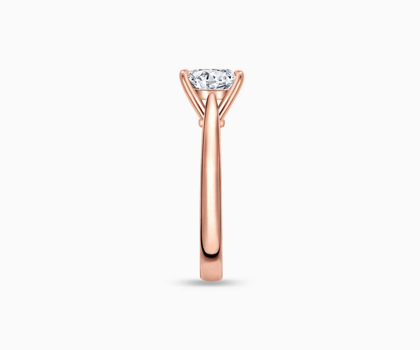 LVC solitaire ring with tapered plain band style that narrows the width towards the mount in rose gold seen from side angle