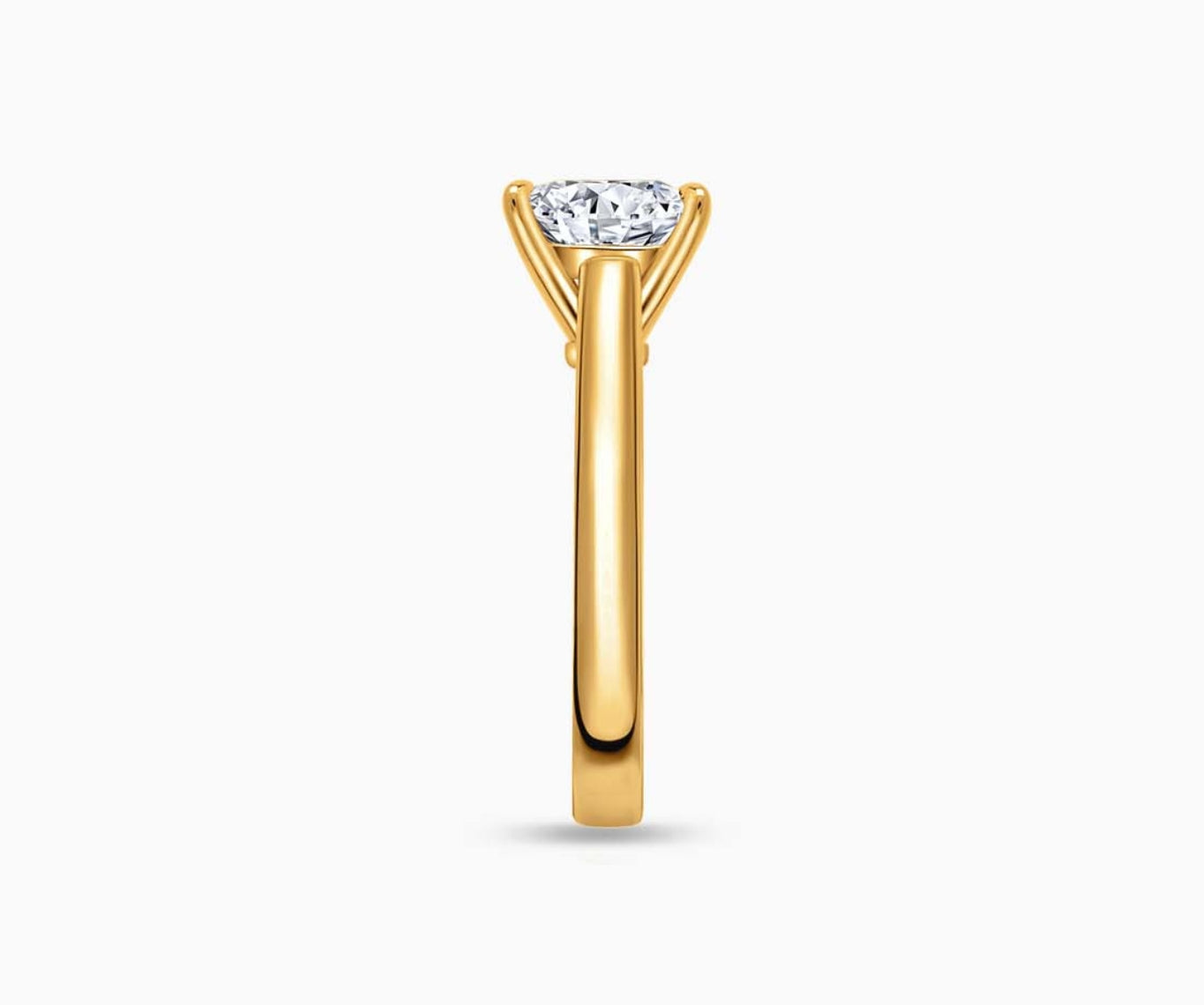 LVC solitaire ring with classic straight pave band lined with side diamonds in yellow gold from side view