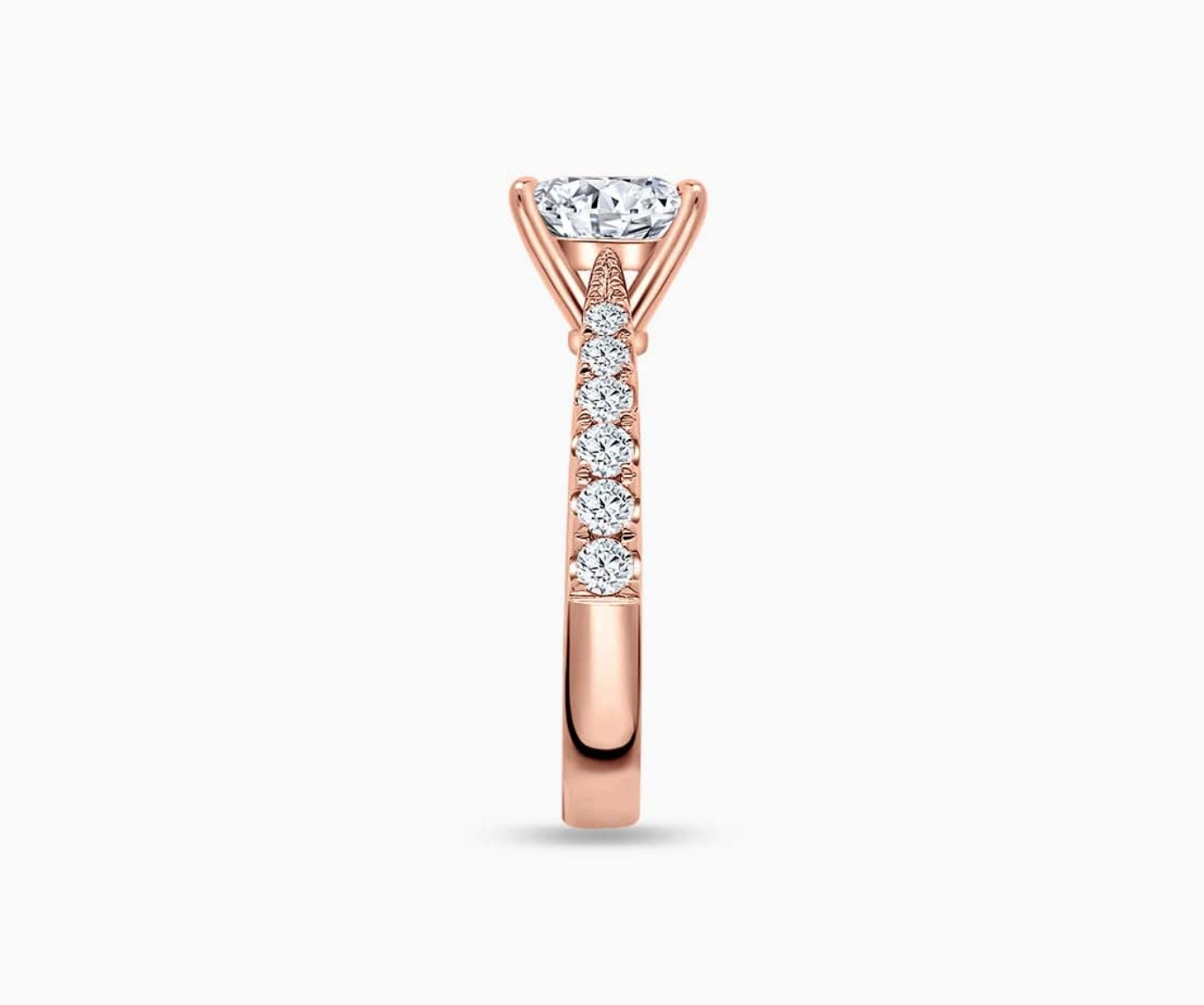 LVC solitaire ring with tapered pave band style, lined with side diamonds in rose gold seen from side angle
