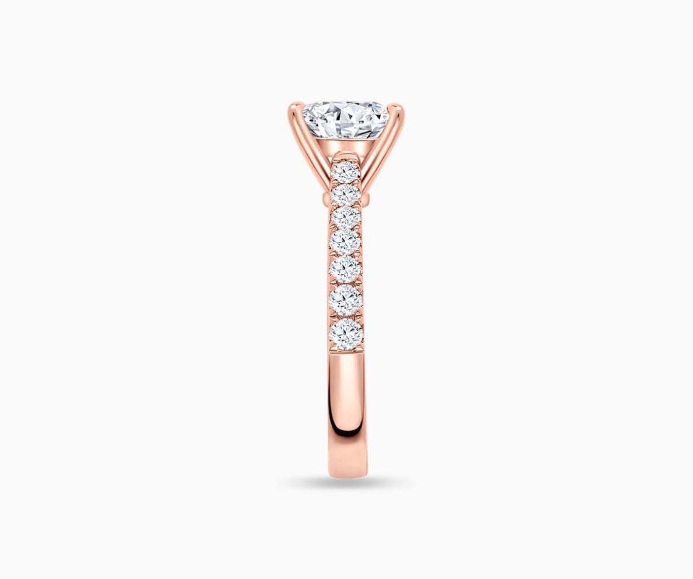 LVC solitaire ring with the classic straight pave band lined with side diamonds for your everyday sparkle in rose gold seen from side angle