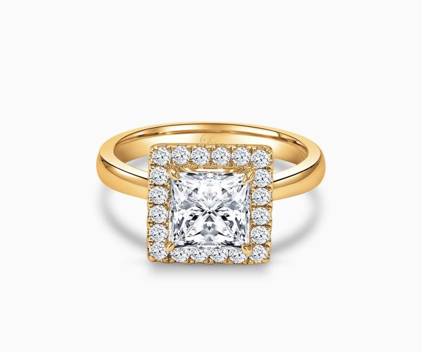 Princess cut diamond halo engagement ring set on yellow gold with a tapered plain band design