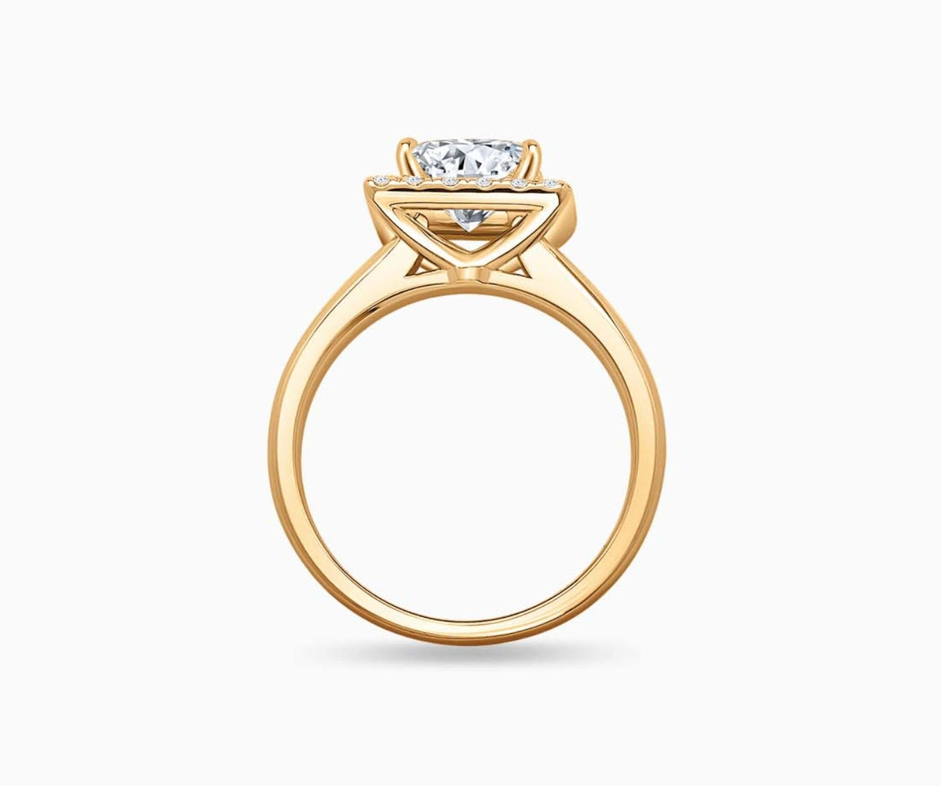 side view of Princess cut diamond halo engagement ring set on yellow gold with a straight plain band design