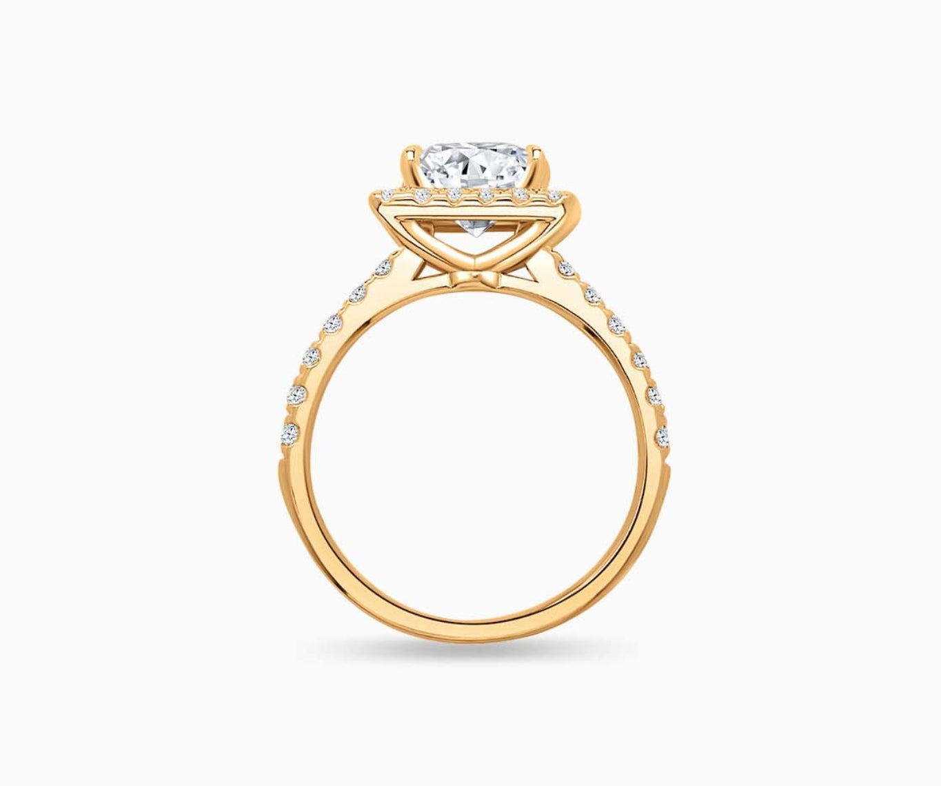 side view of Princess cut diamond halo engagement ring set on yellow gold with a tapered pave band design