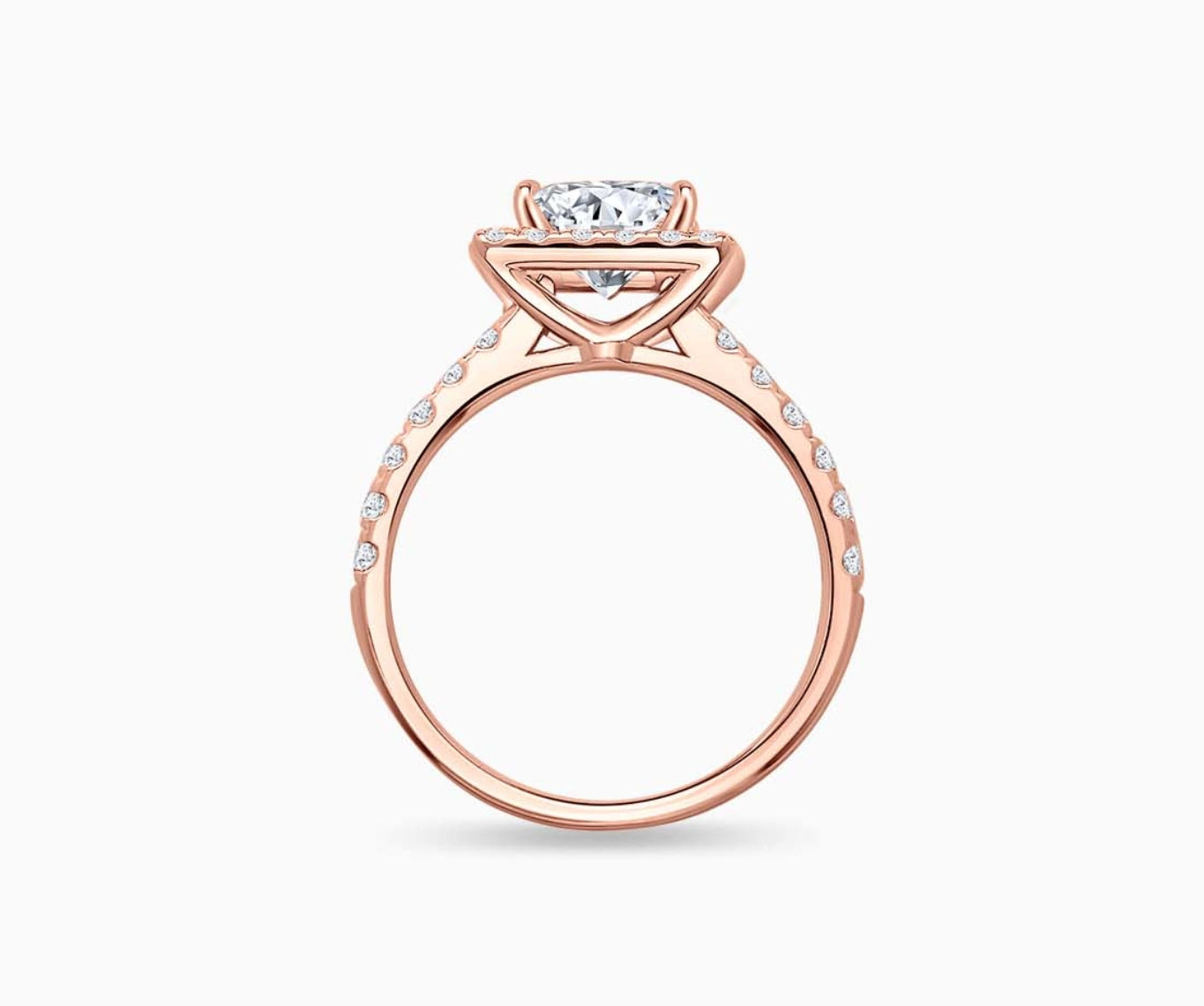 side view of princess cut diamond halo engagement ring set in rose gold with a straight pave band design