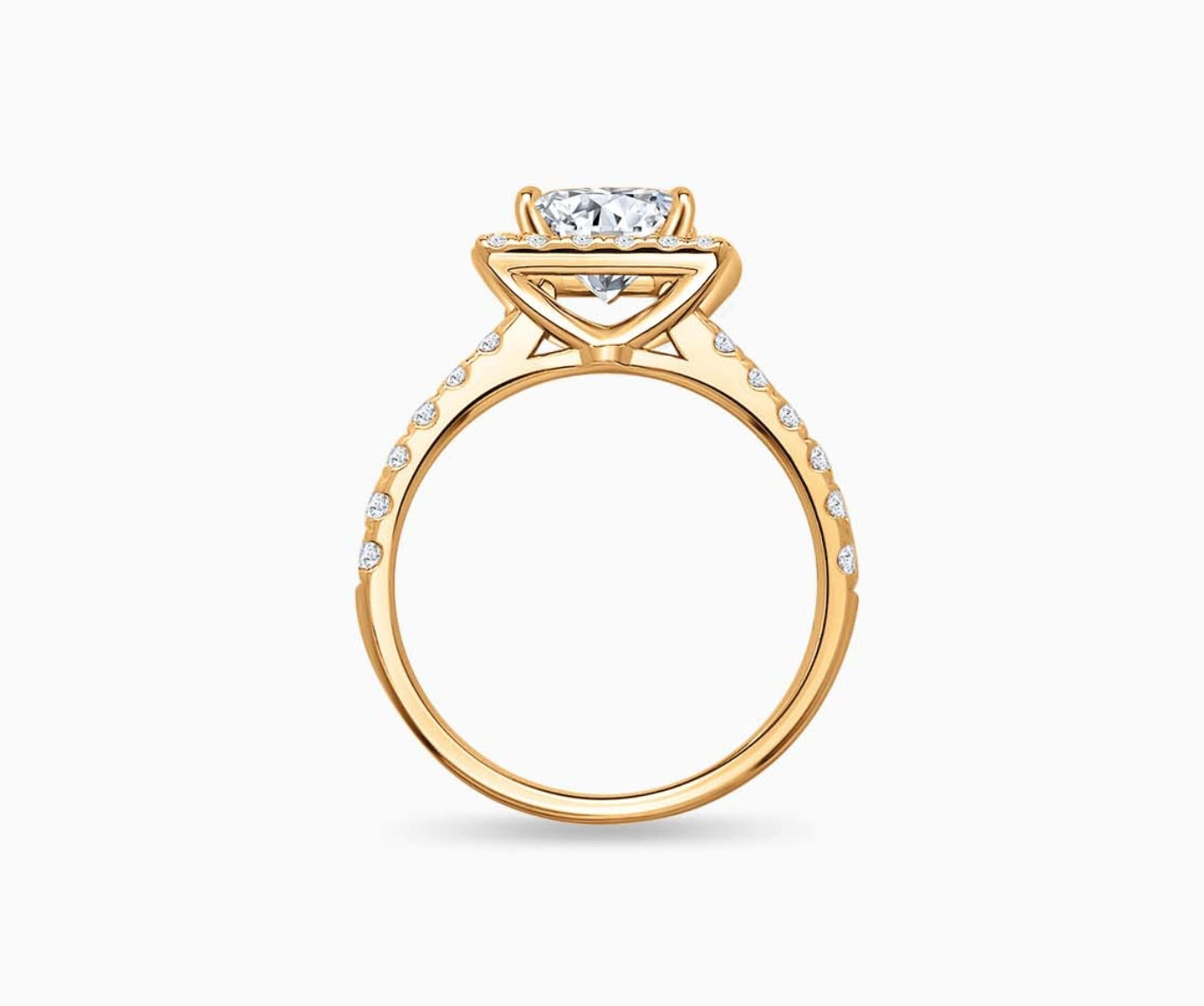 side view of Princess cut diamond halo engagement ring set on yellow gold with a straight pave band design