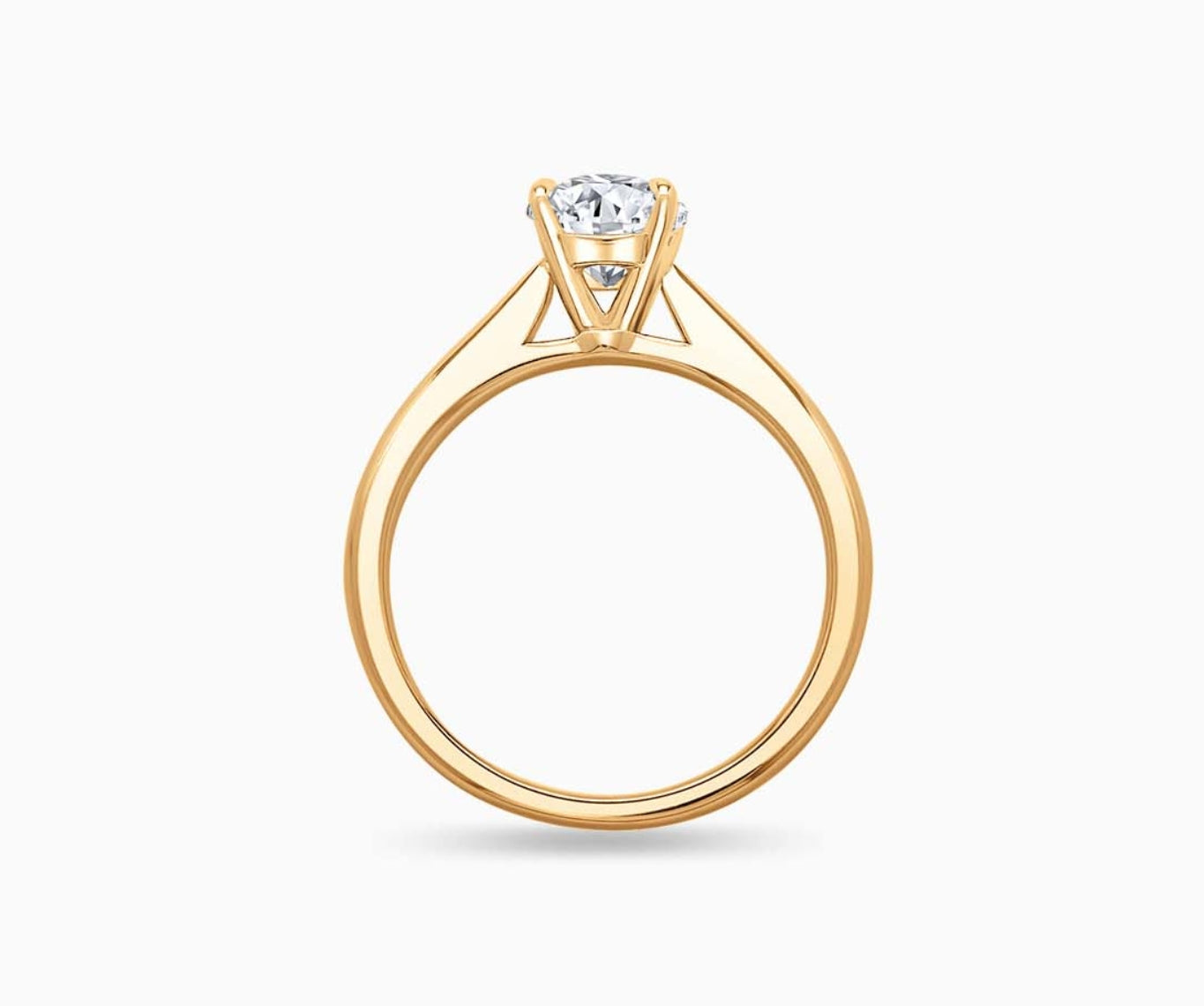 LVC solitaire ring with tapered plain band design which tapers inwards going from thick to thin and diamond on the centre in yellow gold from different angle
