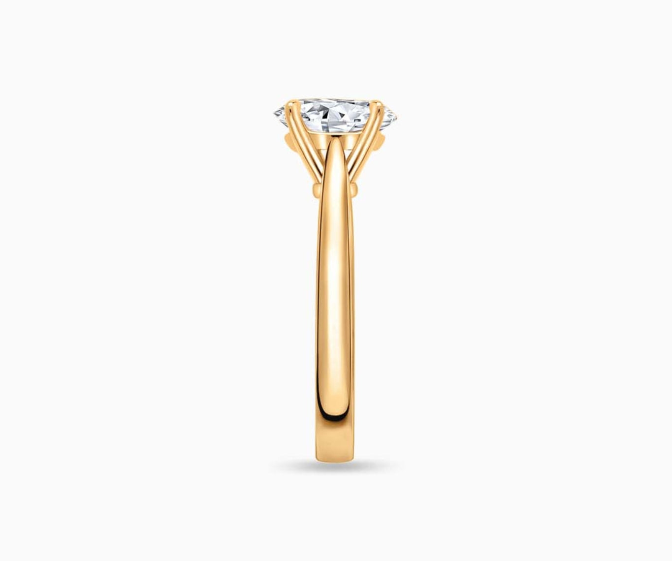 LVC solitaire ring with tapered plain band design which tapers inwards going from thick to thin and diamond on the centre in yellow gold from side angle