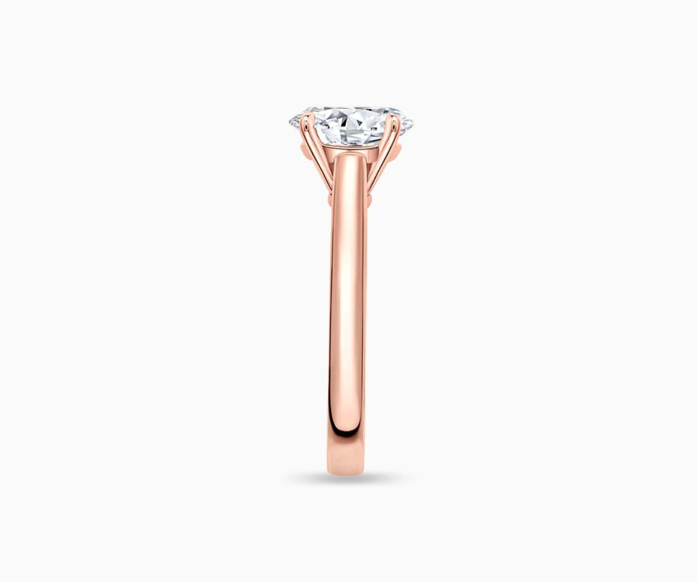 LVC solitaire ring with classic straight plain band with a diamond on the centre made for your everyday sparkle in rose gold from side view