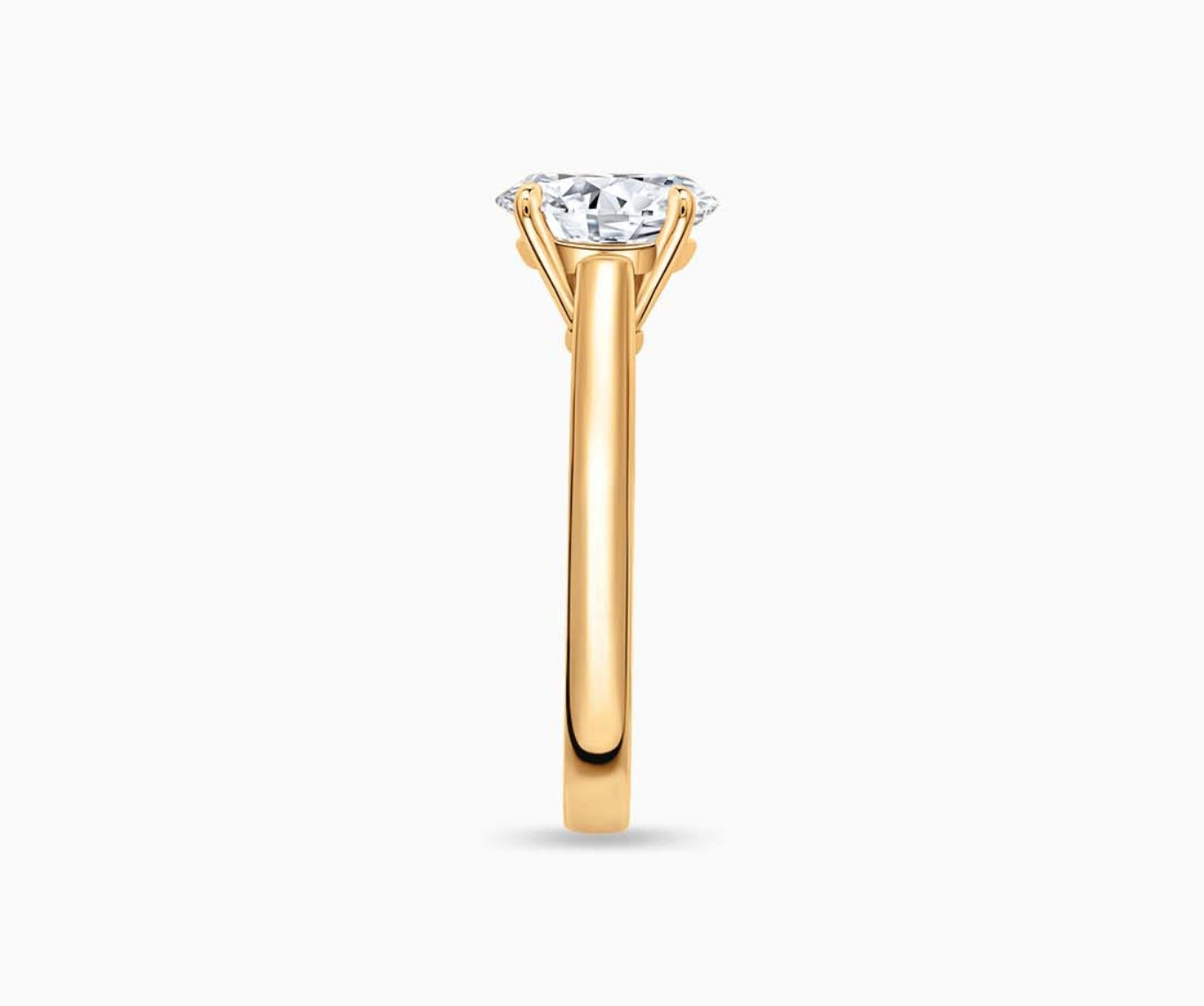 LVC solitaire ring with classic straight band and diamond on the centre in yellow gold from side angle