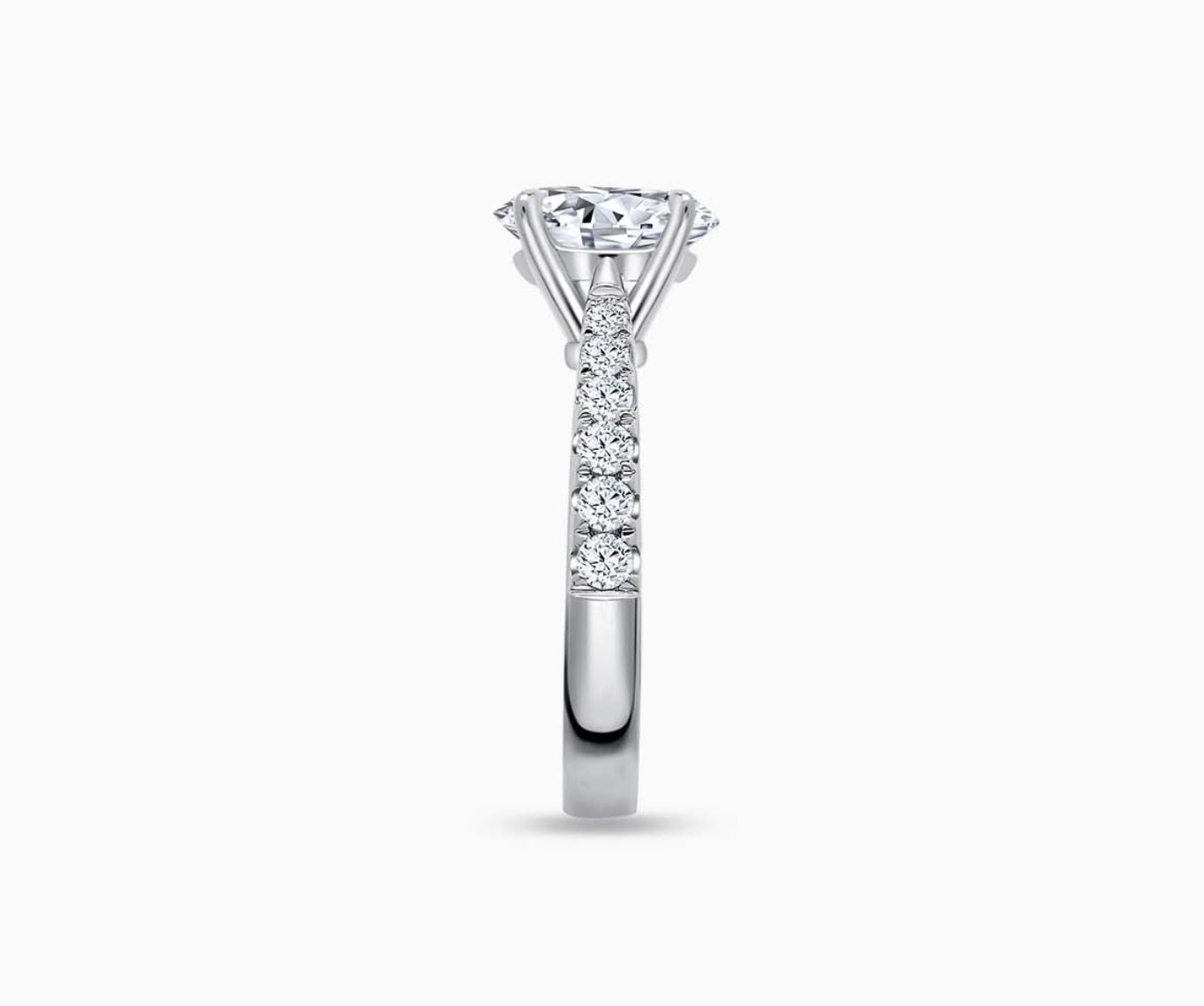 LVC solitaire ring with tapered pave band style, lined with side diamonds seen from side angle