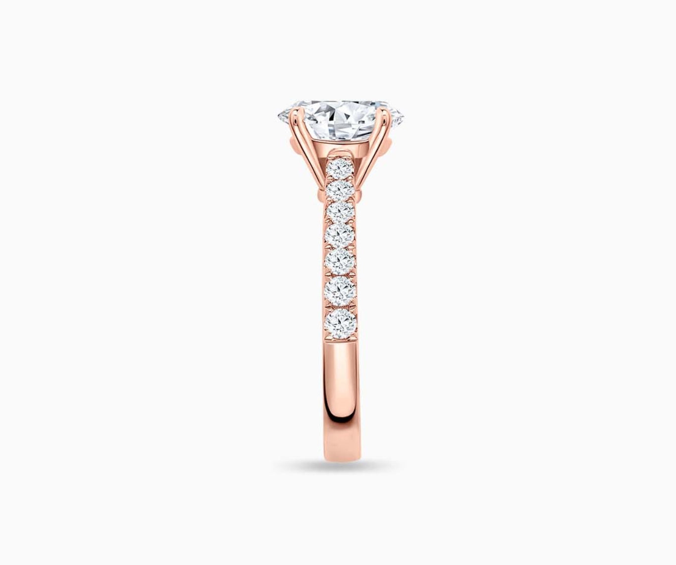 LVC solitaire ring with the classic straight pave band lined with side diamonds for your everyday sparkle in rose gold from side view