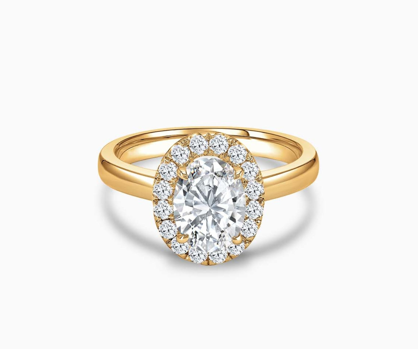 Oval cut diamond halo engagement ring set on yellow gold with a straight plain band design