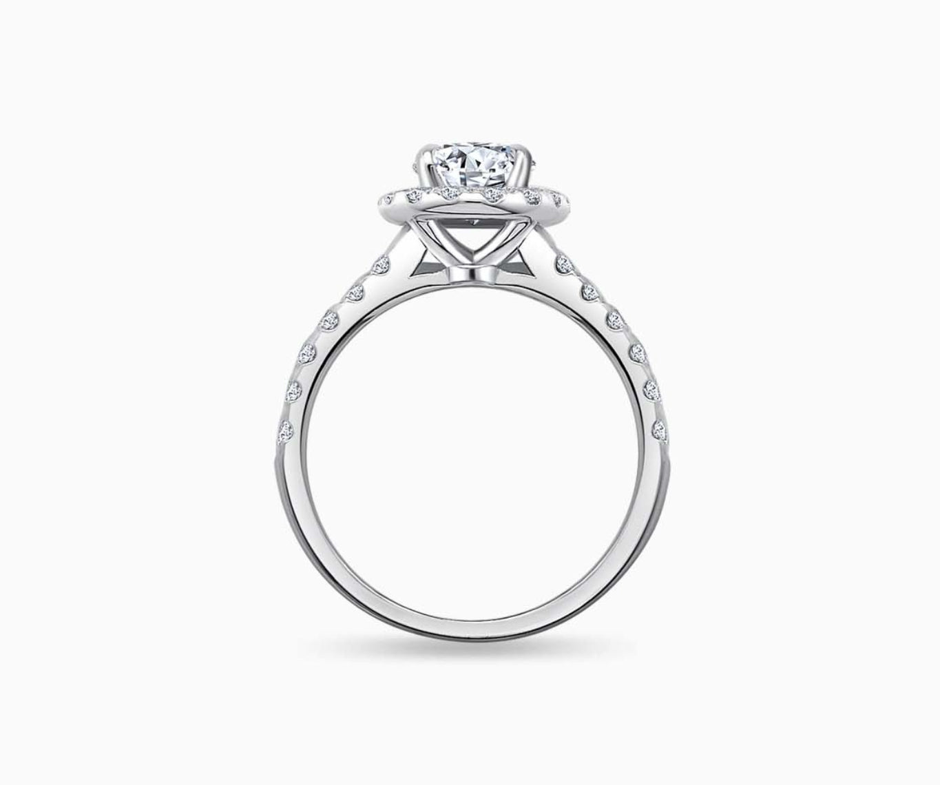 side view of oval cut diamond halo engagement ring with a tapered straight pave white gold band 