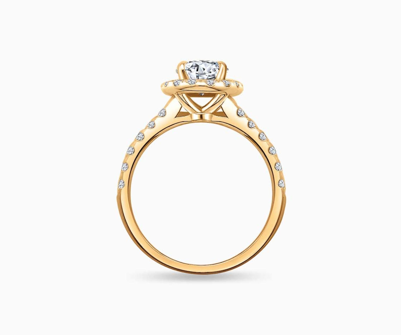side view of Oval cut diamond halo engagement ring set on yellow gold with a straight pave band design