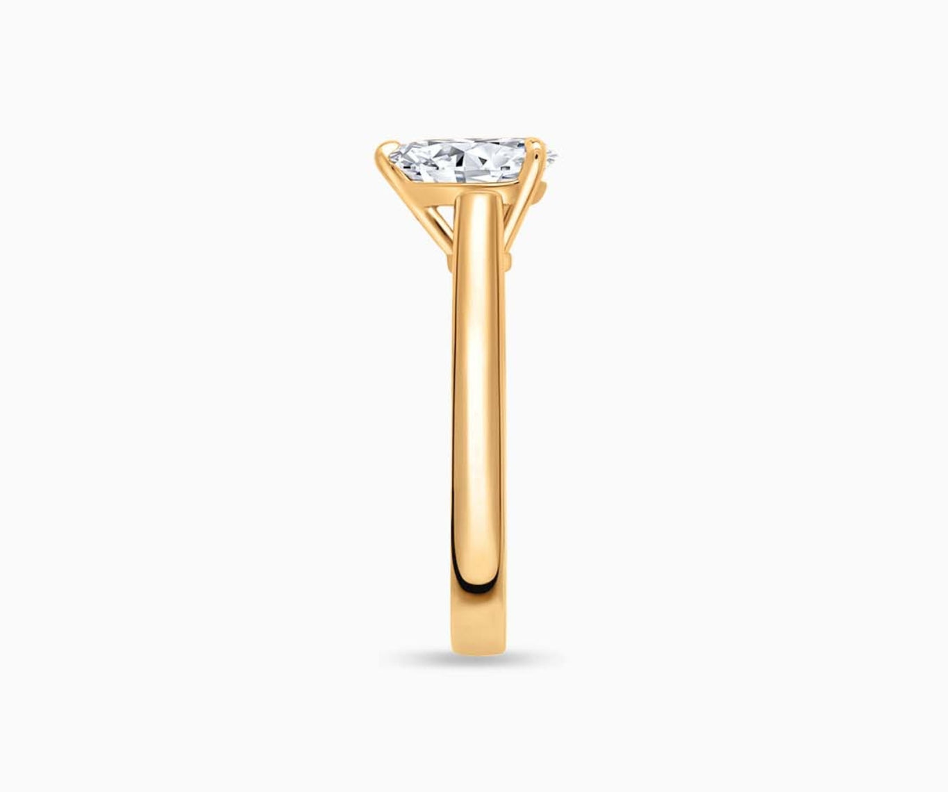 LVC solitaire ring with classic straight band and diamond on the centre in yellow gold from side angle