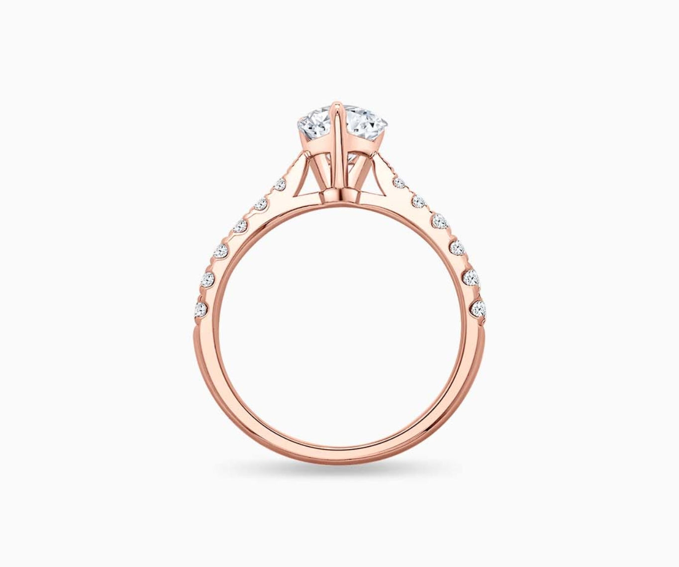 LVC solitaire rings with tapered pave band lined with diamonds and centred diamond in rose gold from another angle