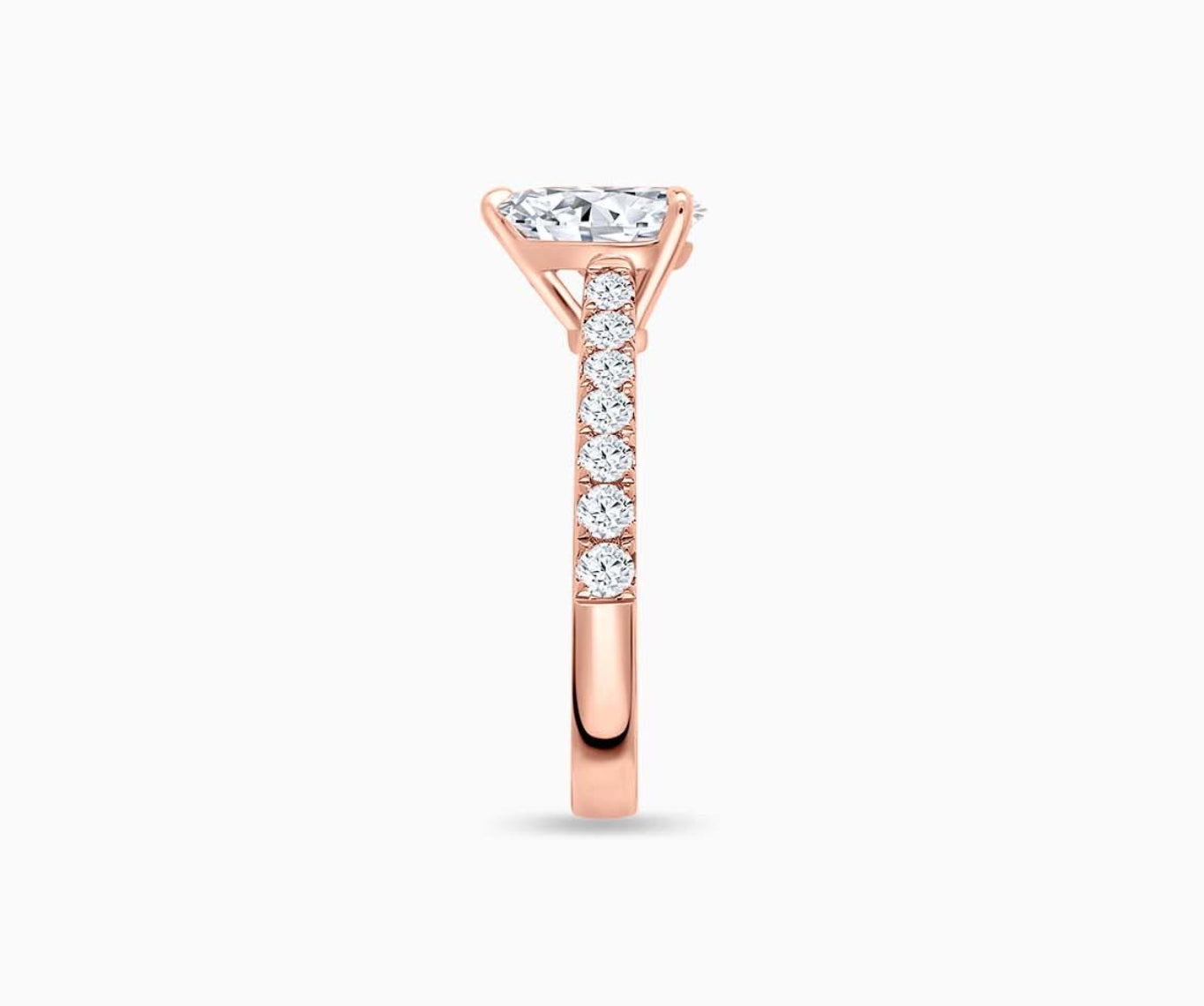 LVC solitaire ring in classic straight band lined with side diamonds for your everyday sparkle in rose gold from side angle 