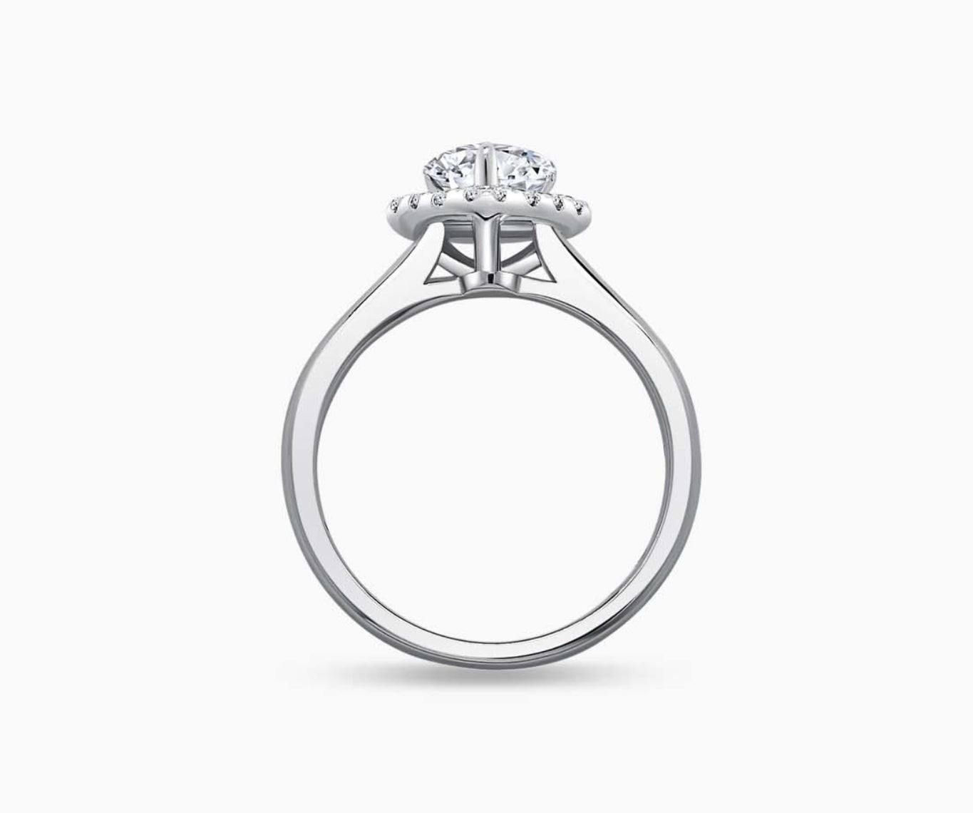 side view of Pear Shaped halo diamond engagement ring with tapered plain band 